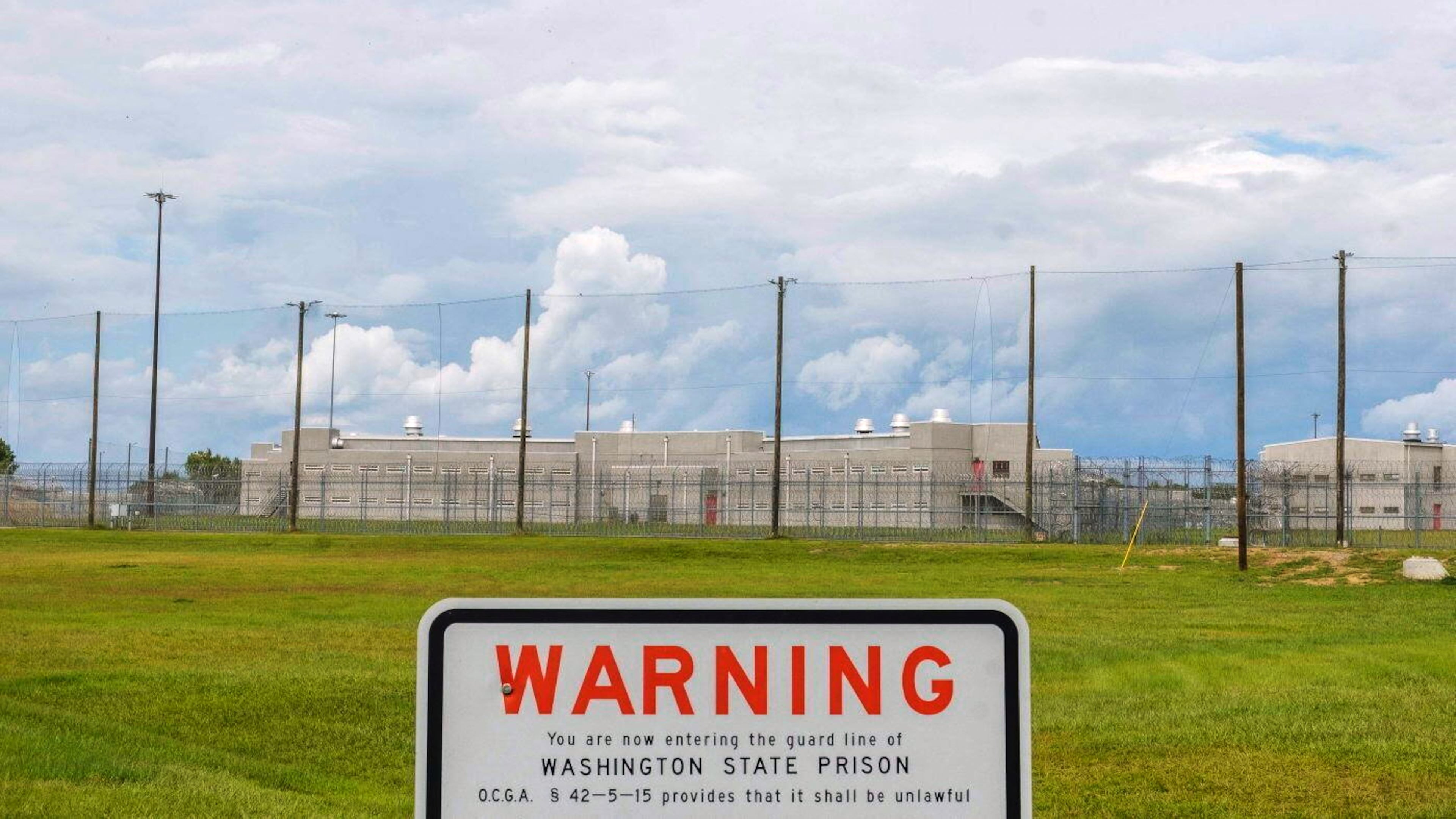 A warning sign is posted outside Washington State Prison in Davisboro, Ga., Friday Aug. 12, 2022. (Grant Blankenship/Georgia Public Broadcasting via AP)