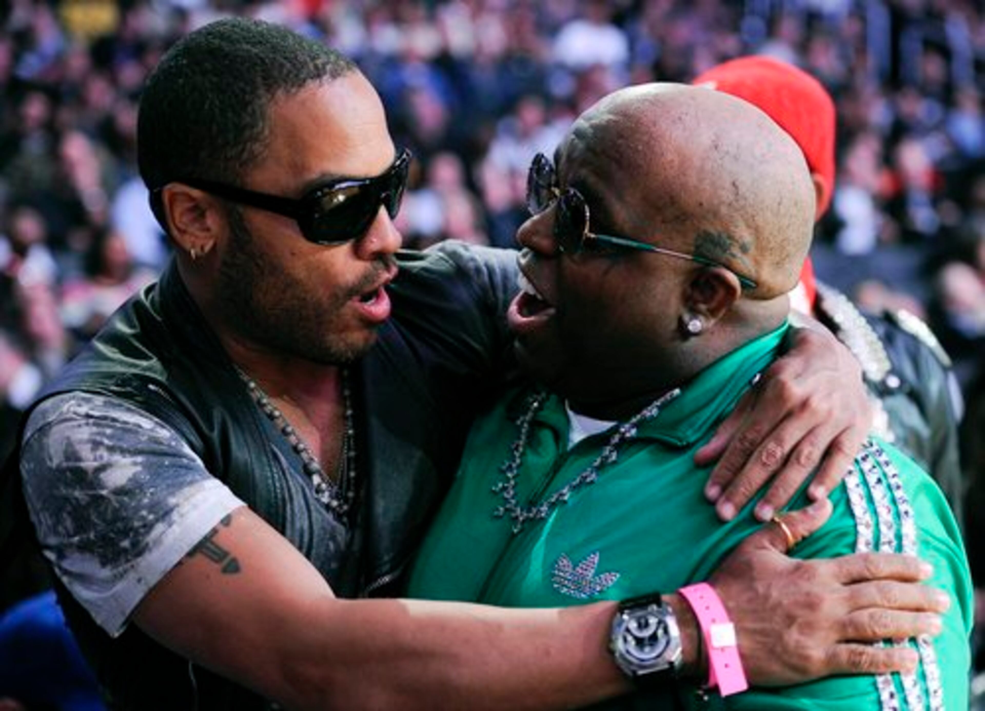 Lenny Kravitz and Cee Lo Green embrace during the NBA basketball All-Star weekend, Saturday, Feb. 19, 2011, in Los Angeles.