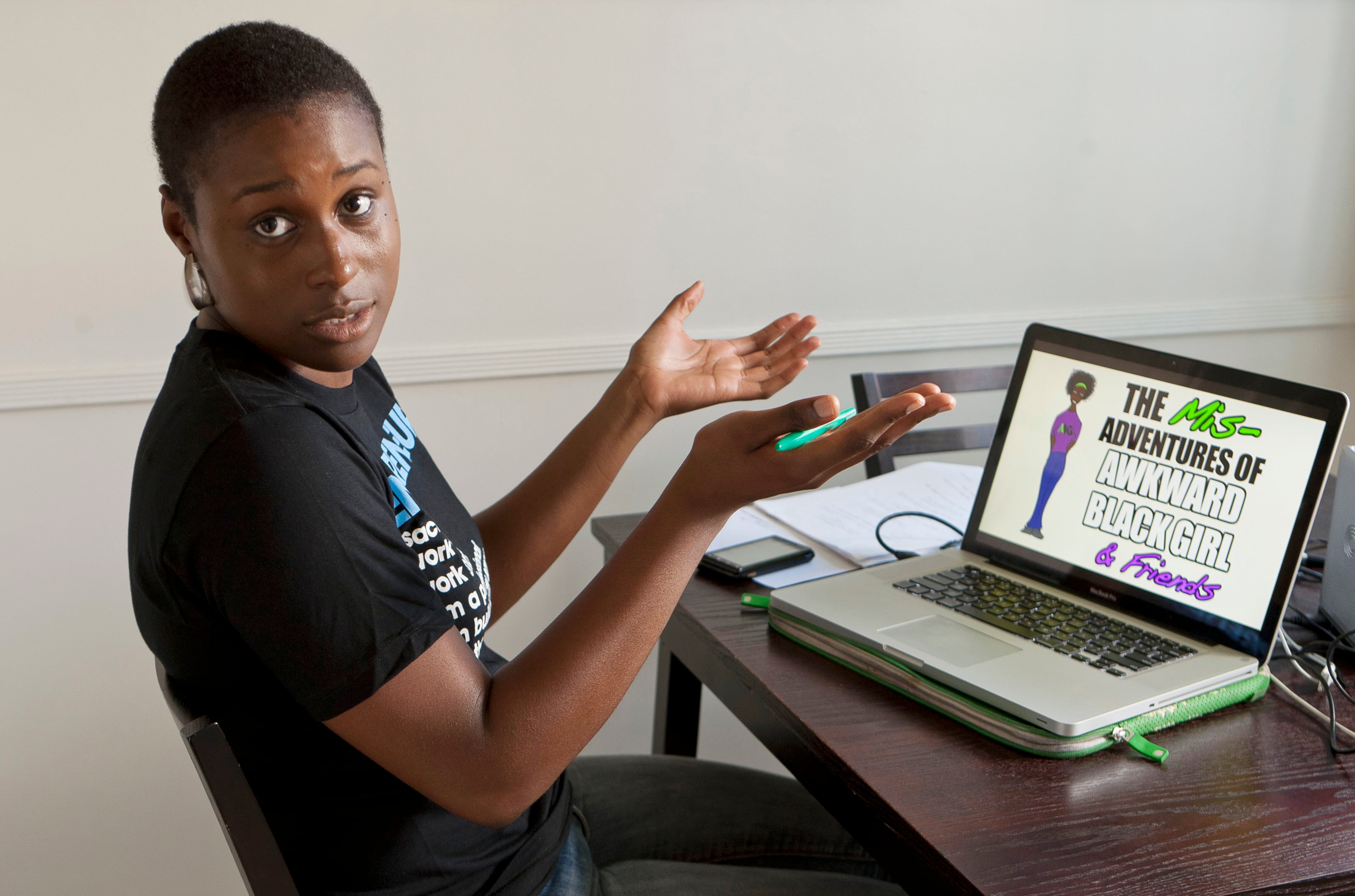 Director Issa Rae creator of the YouTube series "The Misadventures of Awkward Black Girl," works on her video series last edits on her kitchen table Wednesday, Sept. 7, 2011, in Los Angeles. Rae quit her regular job to do her YouTube show, which has received more than 200,000 online hits on some episodes with more than 1 million hits total.