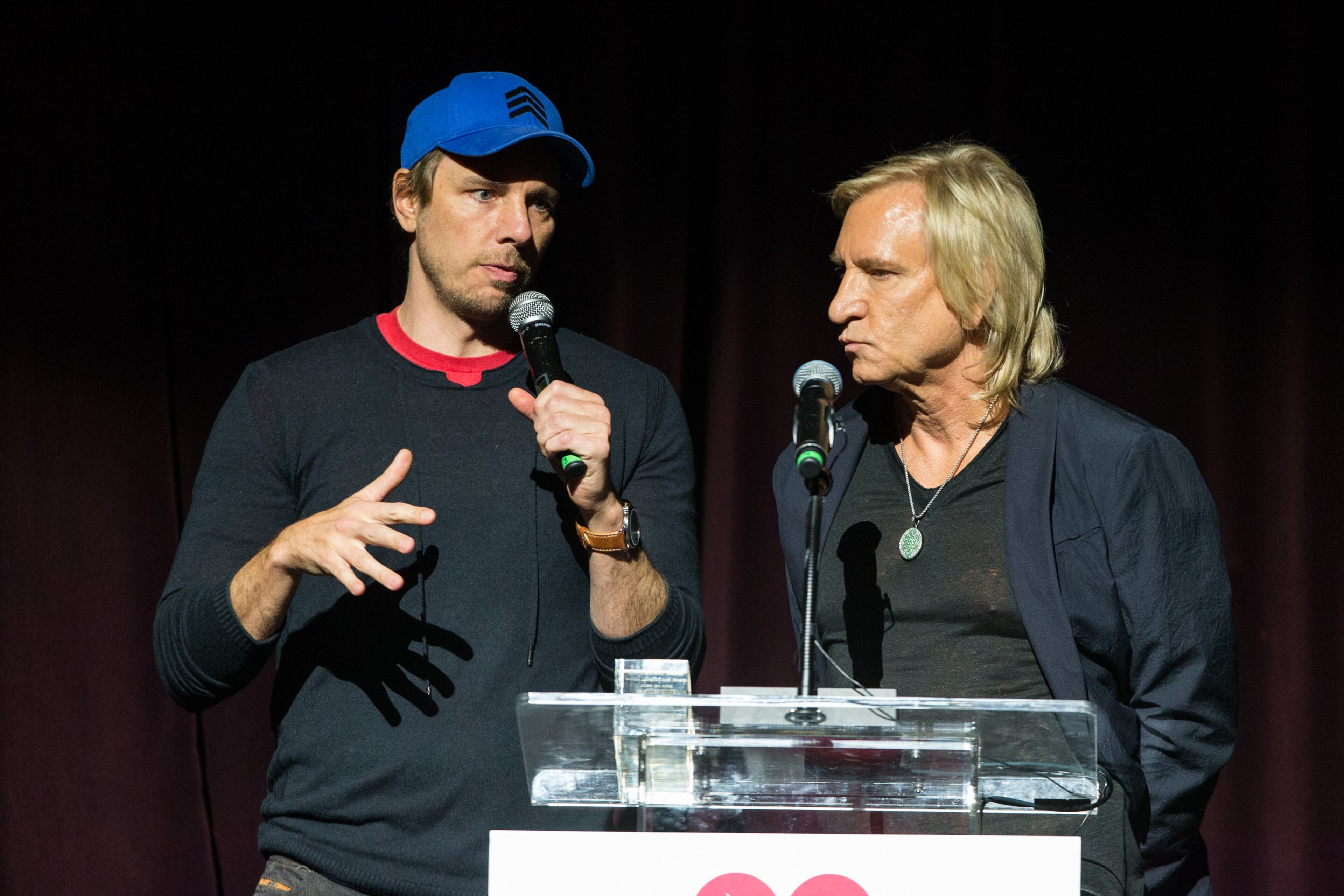 Comedian Dax Shepard and Joe Walsh speak on stage at the 10th annual MusiCares MAP Fund Benefit Concert at Club Nokia on Monday, May 12, 2014 in Los Angeles. (Photo by Paul A. Hebert/Invision/AP)