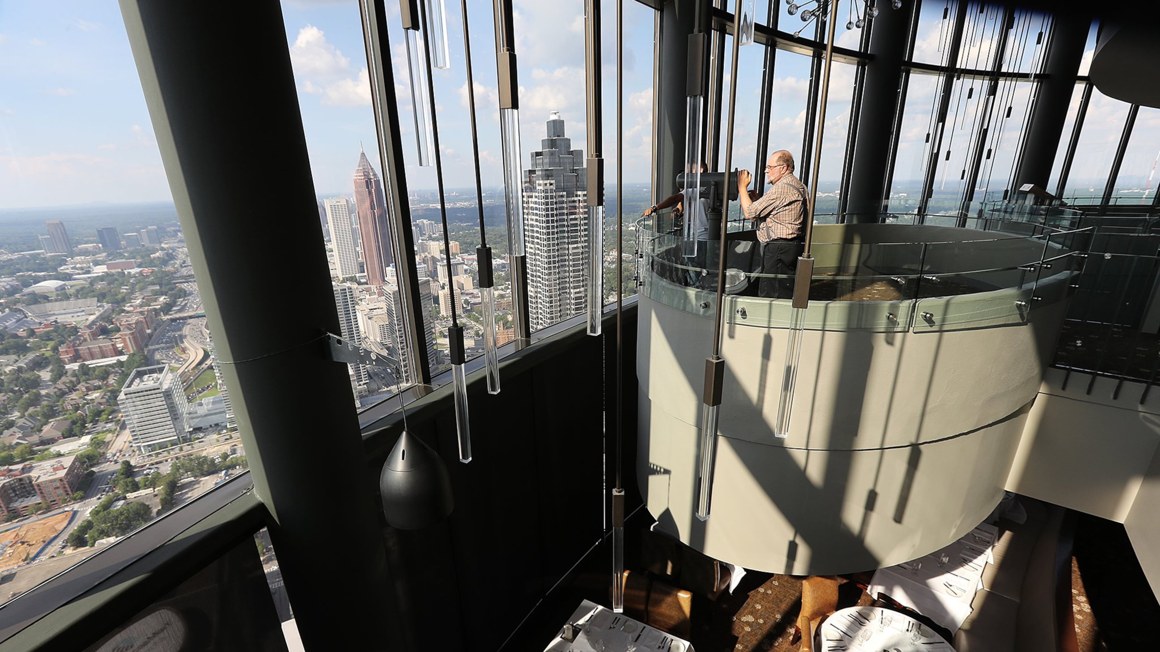 A visitor from South Dakota takes in the view of Atlanta from The Sun Dial Restaurant during an August visit to Atlanta. (CURTIS COMPTON /ccompton@ajc.com)