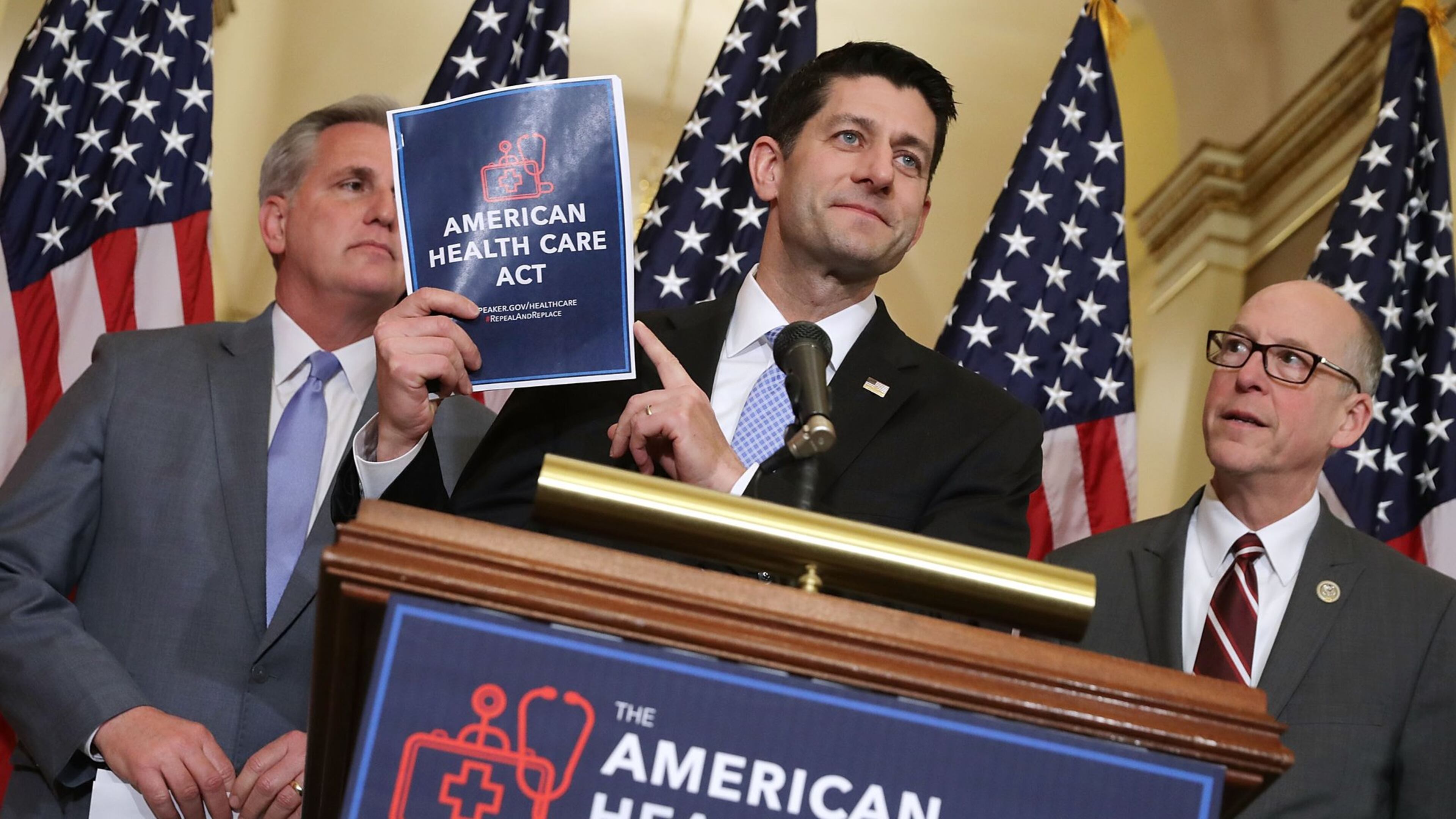 WASHINGTON, DC - MARCH 07: Speaker of the House Paul Ryan (R-WI) (C) holds up a copy of the American Health Care Act during a news conference with House Majority Leader Kevin McCarthy (R-CA) (L) and House Energy and Commerce Committee Chairman Greg Walden (R-OR) outside Ryan’s office in the U.S. Capitol March 7, 2017. (Photo by Chip Somodevilla/Getty Images)