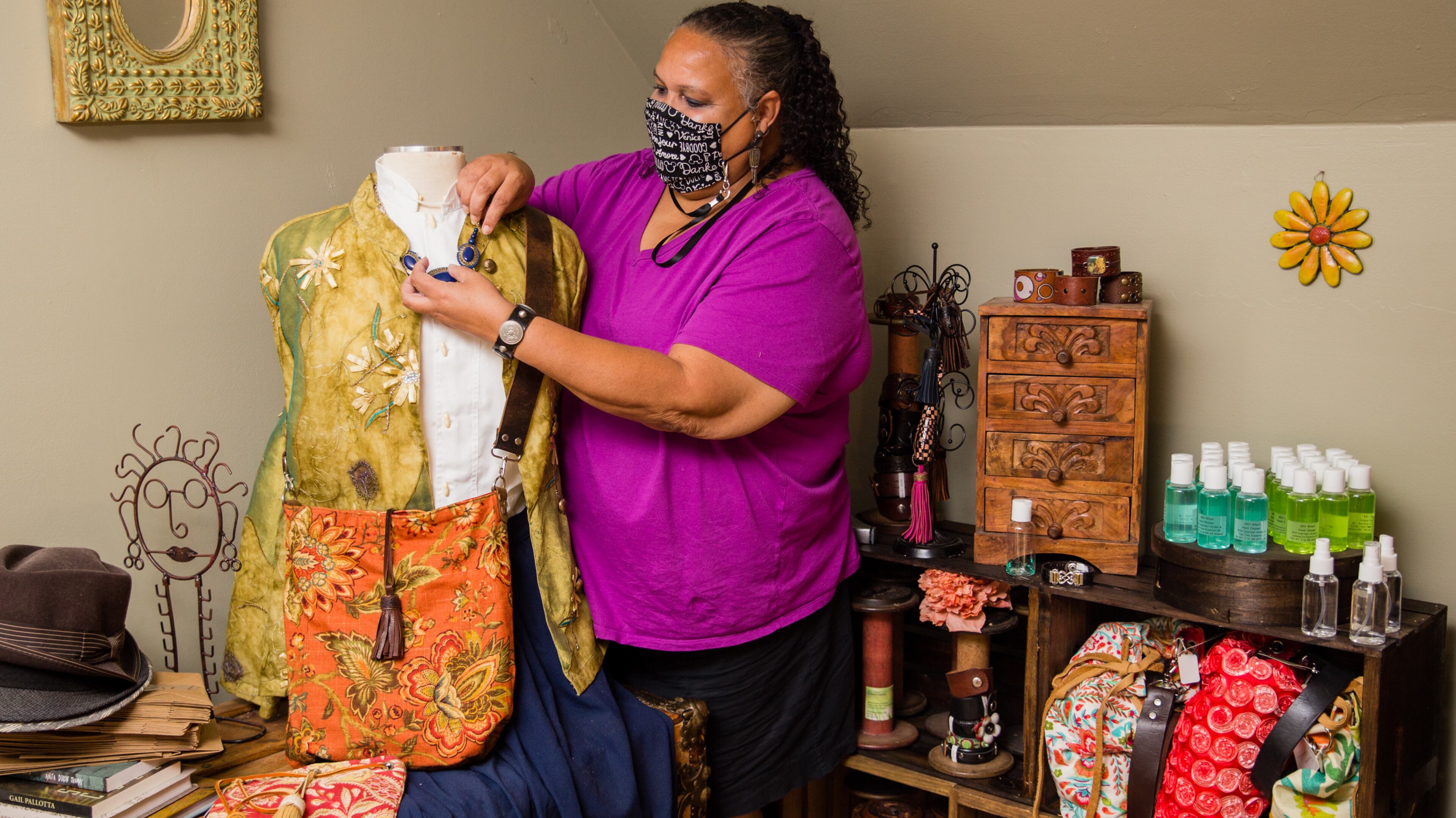 Susan Hurst of Marietta is a participant in a COVID-19 vaccine trial that will last two years and requires monthly doctor visits, treatments and data collection. Hurst stays busy at her day job working in finance and she's making reversible handbags, leather jewelry and belts and masks, which she was selling at local markets before the pandemic. (Jenni Girtman for The Atlanta Journal-Constitution)