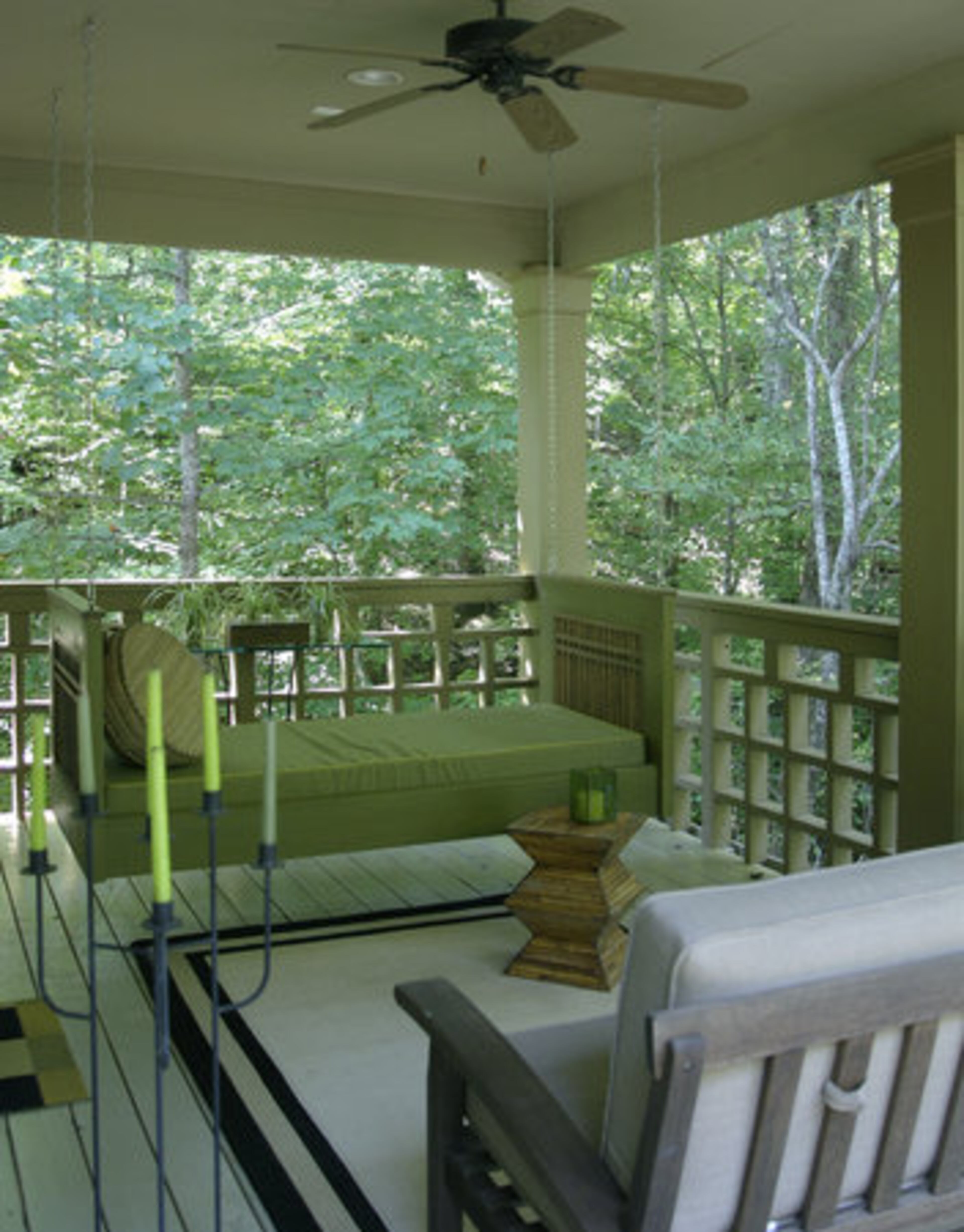 The day bed swing on the deck off the master bedroom allows Scott Mills "to lie down and see the trees."