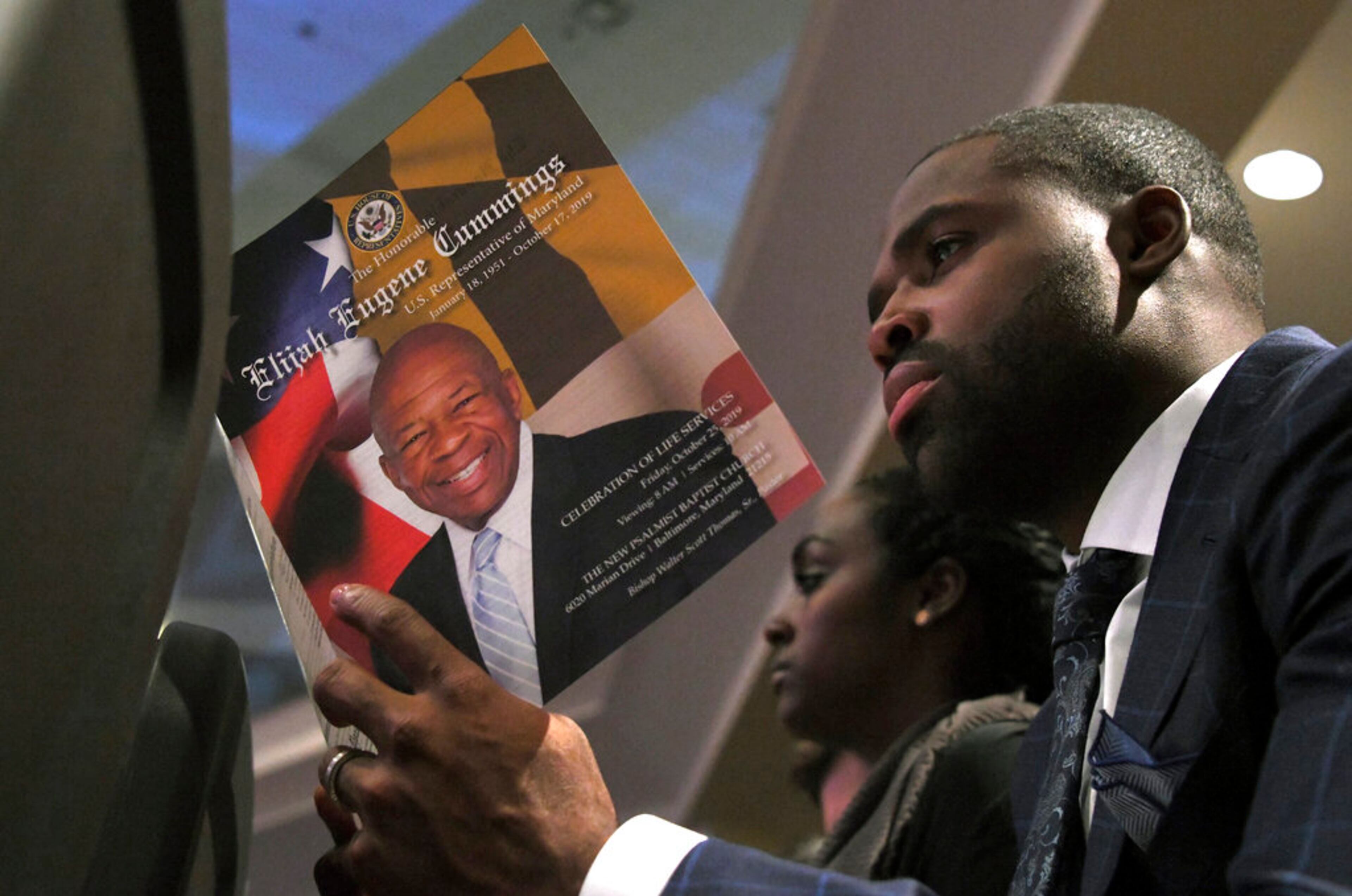 Former Baltimore Raven Torrey Smith looks at the program at the funeral service for Rep. Elijah Cummings, D-Md., at the New Psalmist Baptist Church in Baltimore, Md., on Friday, Oct. 25, 2019. (Lloyd Fox/The Baltimore Sun via AP, Pool)