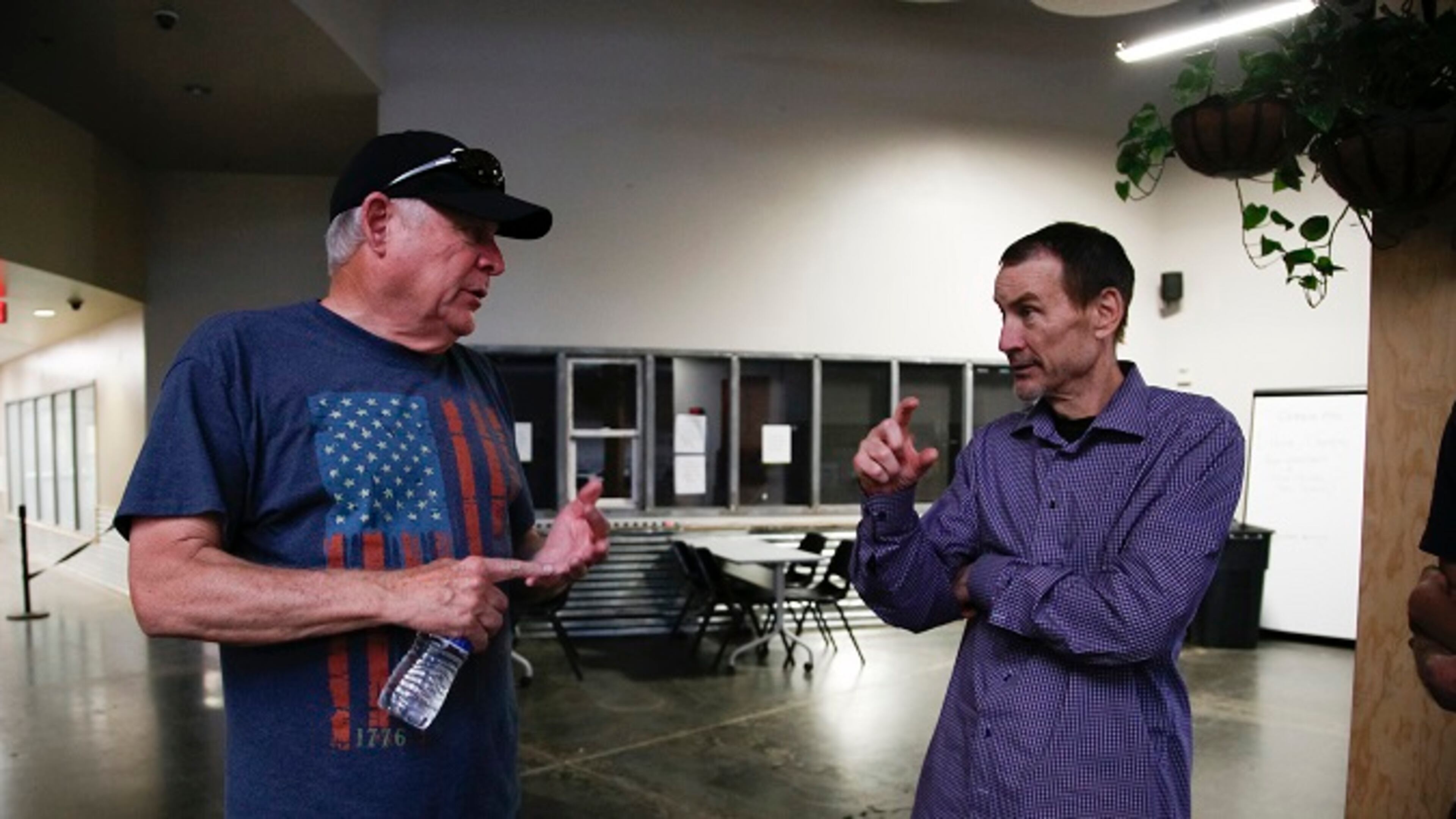 Peter Seidler, right, Padres managing partner gets a up close look at the Human Services Campus in Phoenix with Mike McQuaid. (Nelvin C. Cepeda/San Diego Union-Tribune/TNS)