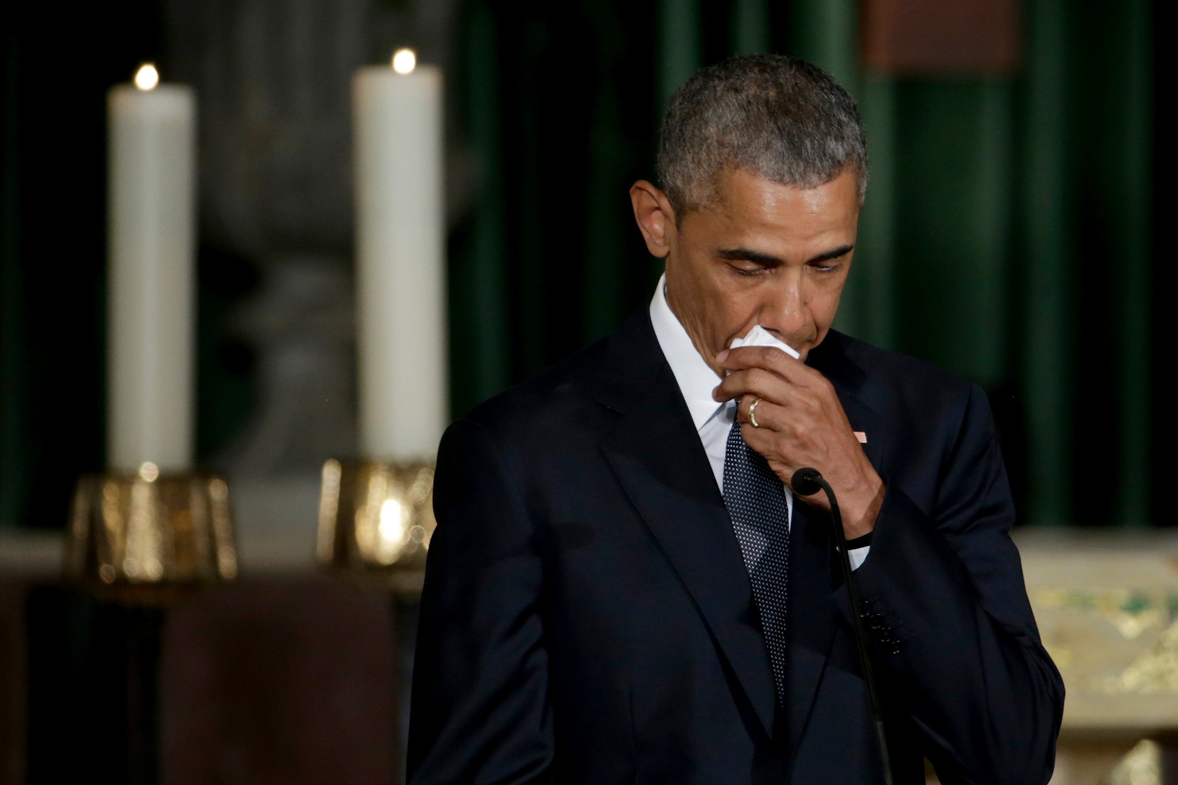 President Barack Obama pauses while delivering the eulogy in honor of former Delaware Attorney General Beau Biden, Saturday, June 6, 2015, at St. Anthony of Padua Church in Wilmington, Del. Biden, Vice President Joe Biden's eldest son, died at the age of 46 after a battle with brain cancer. (AP Photo/Pablo Martinez Monsivais, Pool)