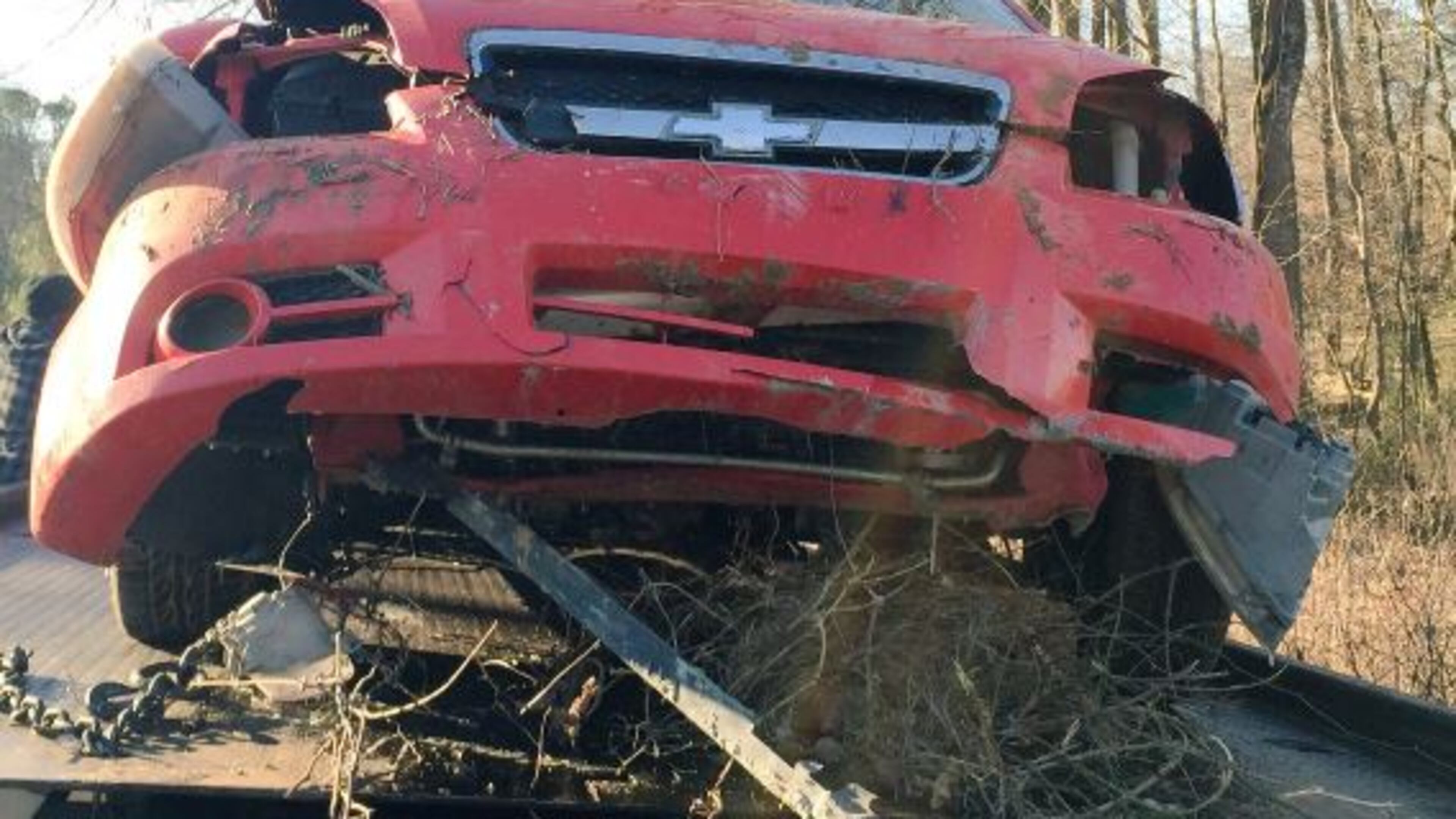 This car, which had four people iiside, was pulled from a water-filled embankment in DeKalb County.