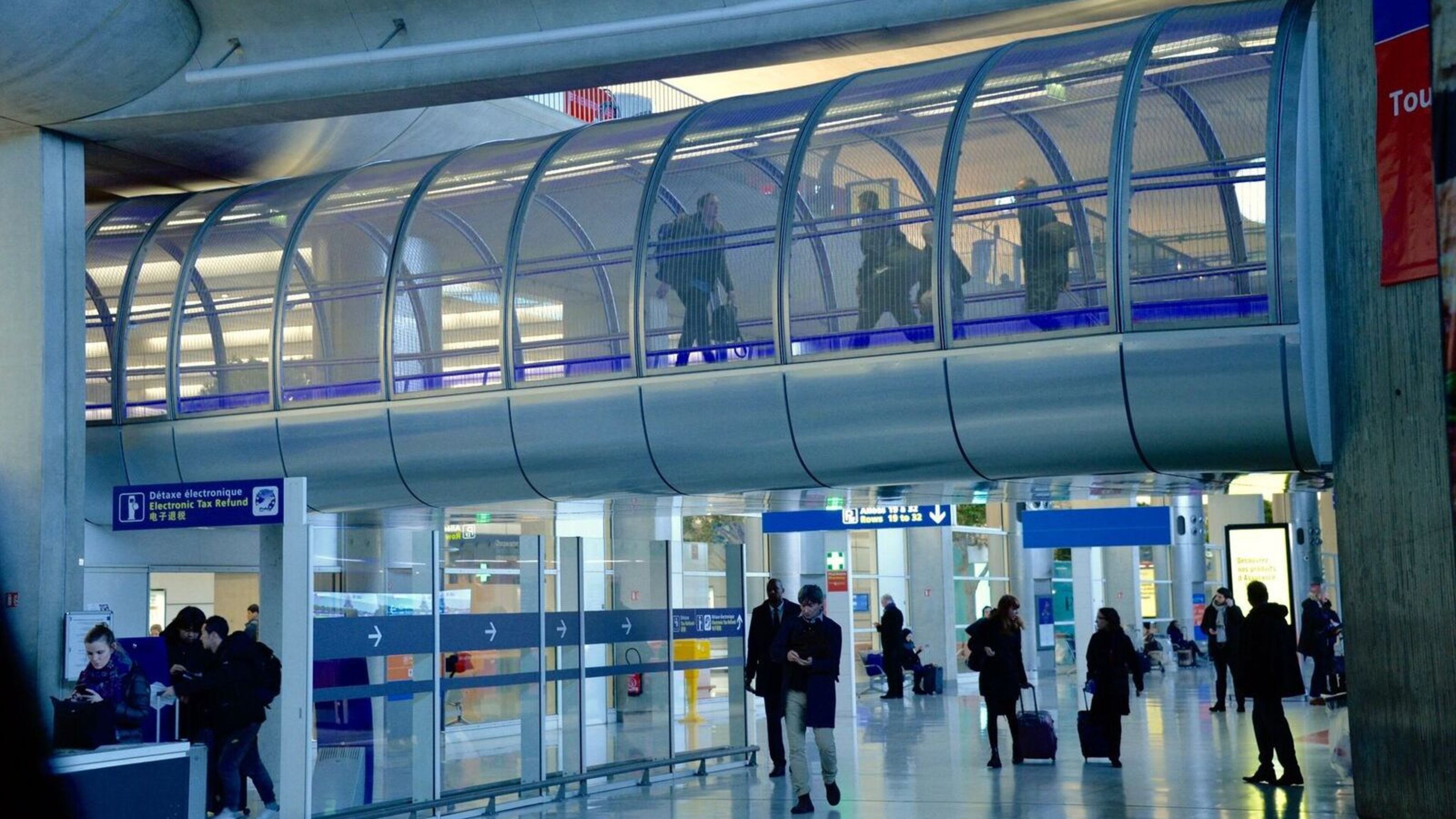 Passengers can use "transit tubes" to connect between flights without going through security a second time. (Jason Ma/TNS)