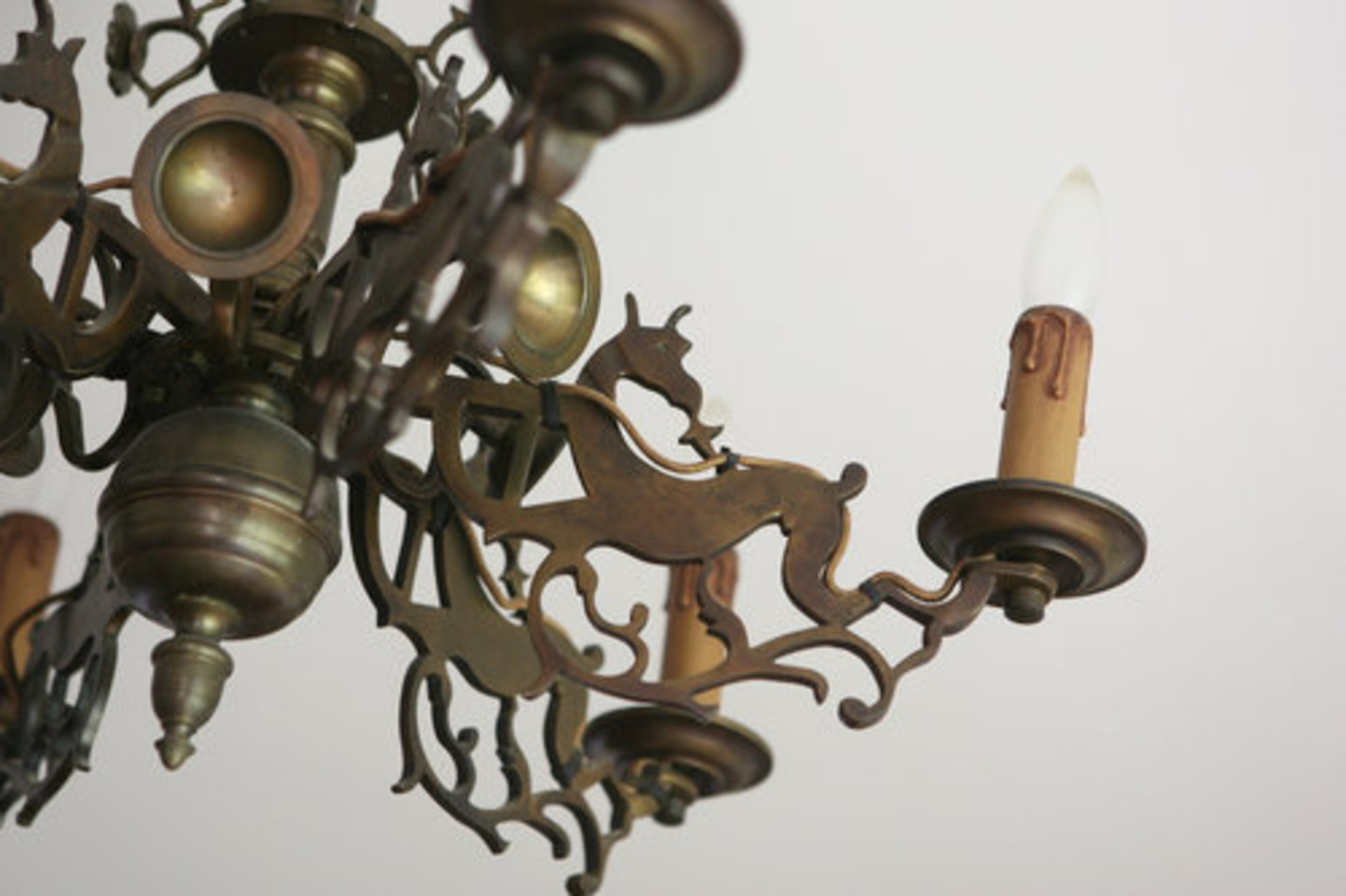 This antique brass chandelier in the dining room was converted from candles to electric.