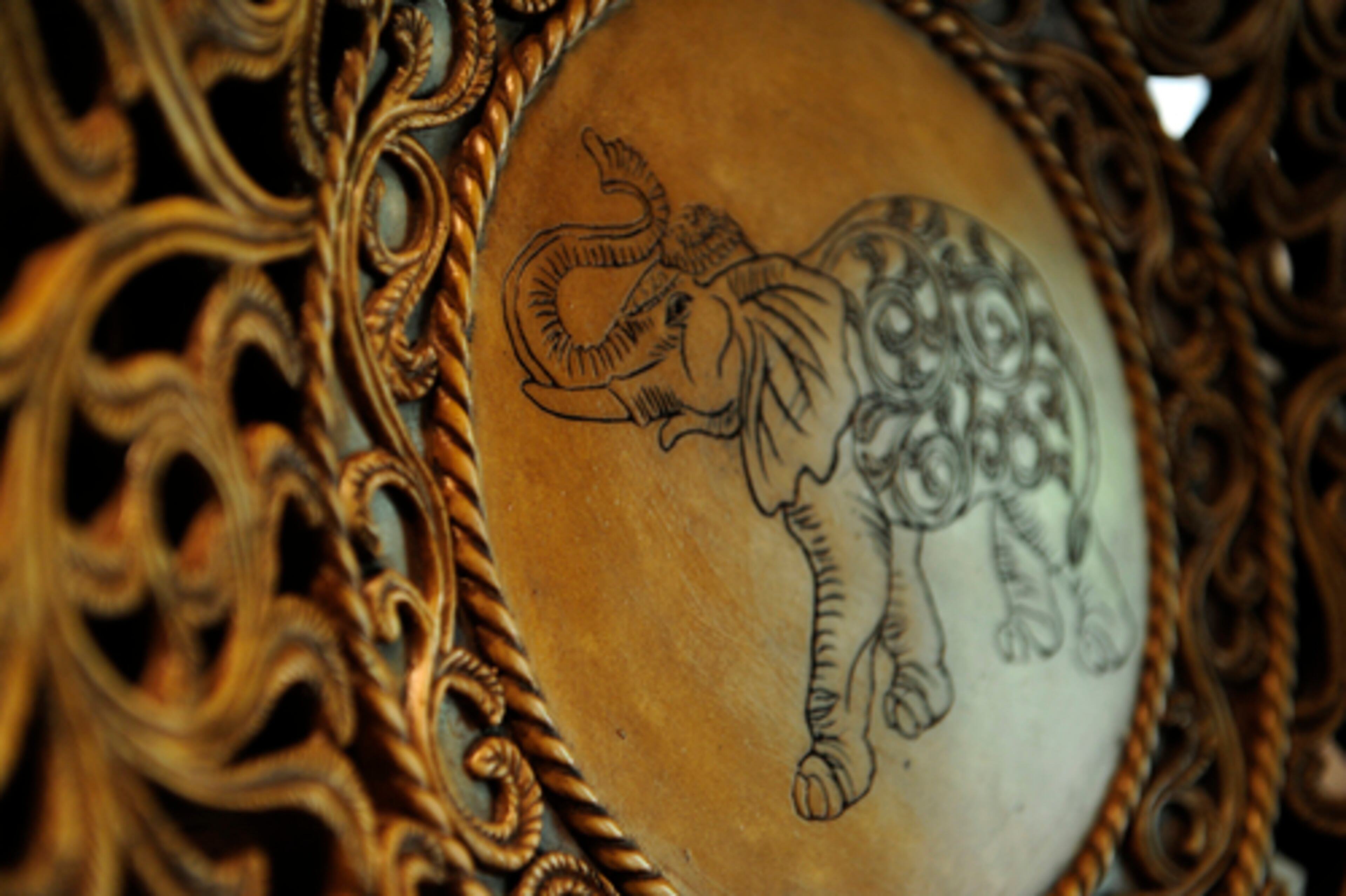 The living room also displays this etched elephant plate. Much of the decor includes souvenirs of the Rogers' extensive international travels. With their four-year-old twins to consider now, Rogers said he plans to spend less time on the road.