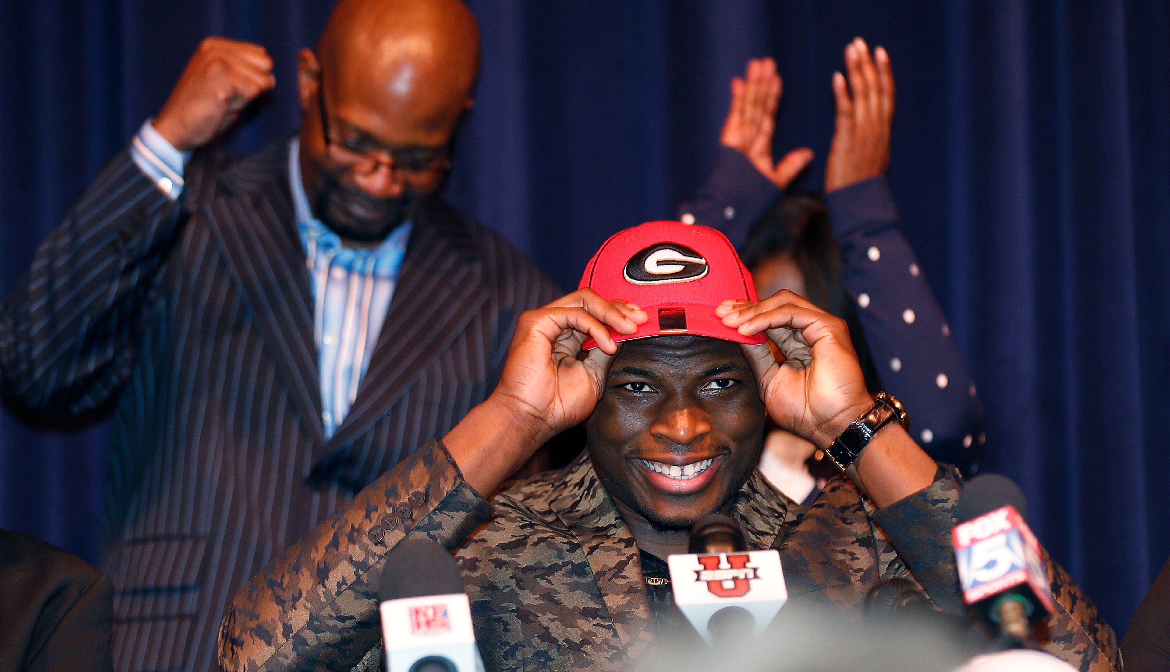 Norcross High School defensive end Lorenzo Carter announces that he plans to attend Georgia and play football, during a news conference Wednesday, Feb. 5, 2014, in Norcorss, Ga. Carter is regarded as the top prospect in Georgia and one of the top pass-rushers in the nation.