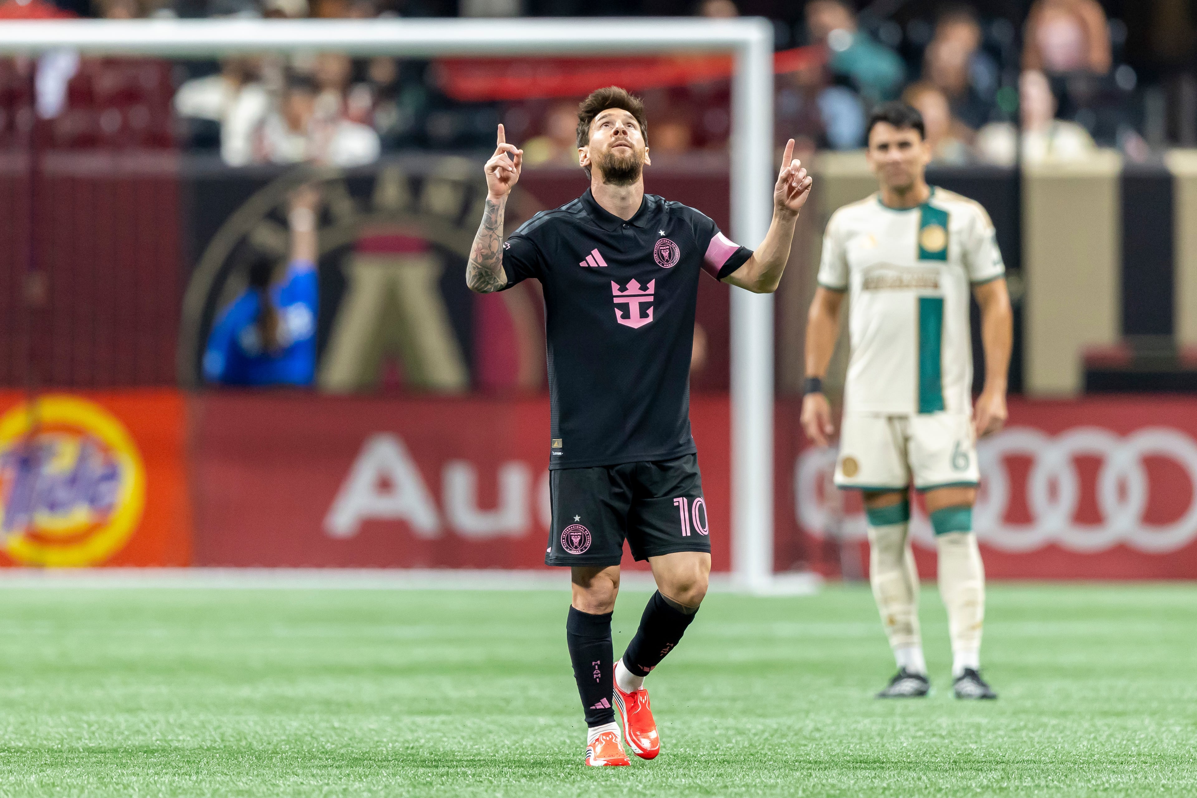 Inter Miami forward Lionel Messi celebrates his first goal against Atlanta United on Saturday. (Vasha Hunt/AP)