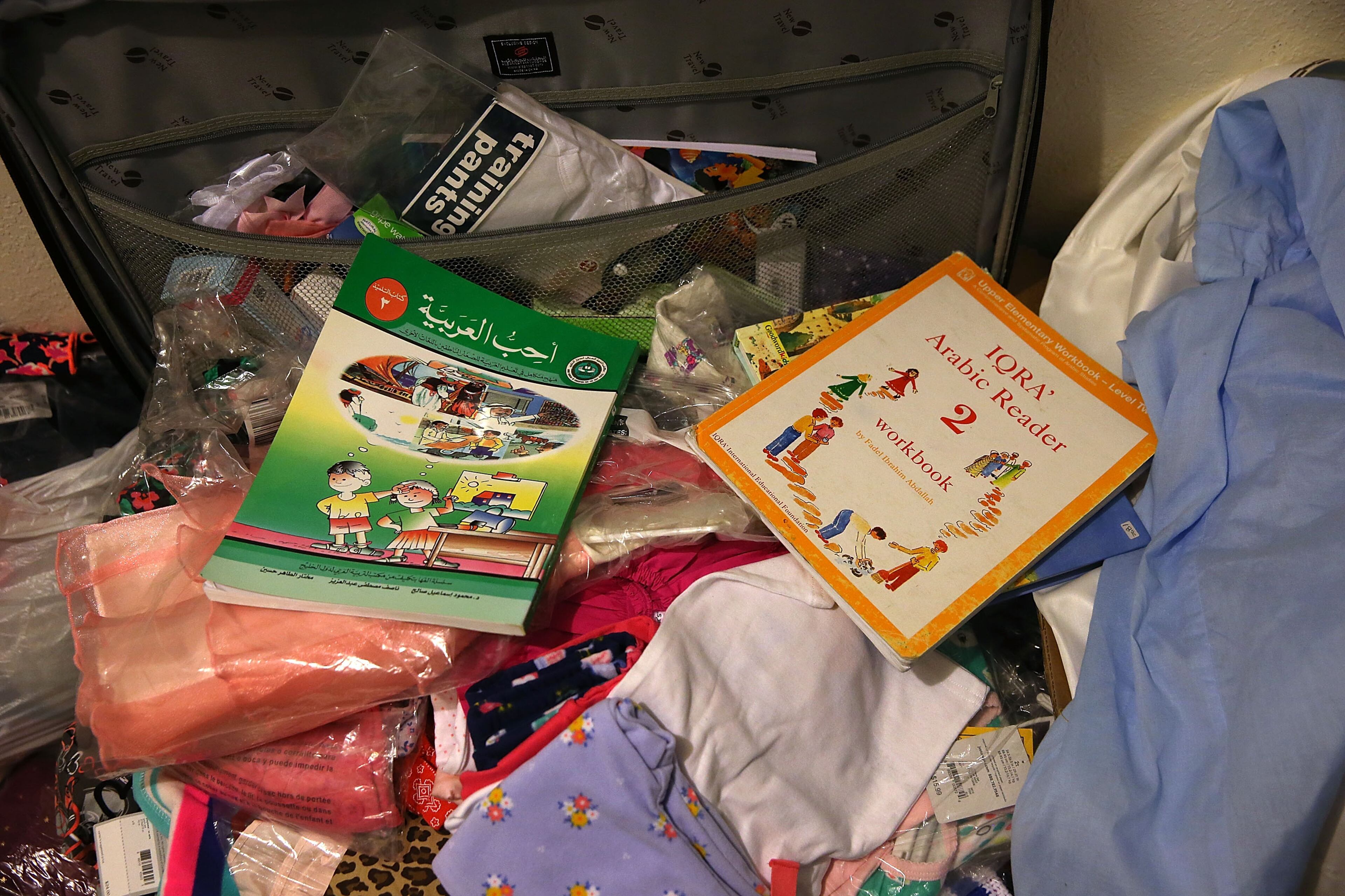 SAN BERNARDINO, CA - DECEMBER 04: Arabic books sit in a closet inside the home of shooting suspect Syed Farook on December 4, 2015 in San Bernardino, California. The San Bernardino community is mourning as police continue to investigate a mass shooting at the Inland Regional Center in San Bernardino that left at least 14 people dead and another 21 injured. (Photo by Justin Sullivan/Getty Images)