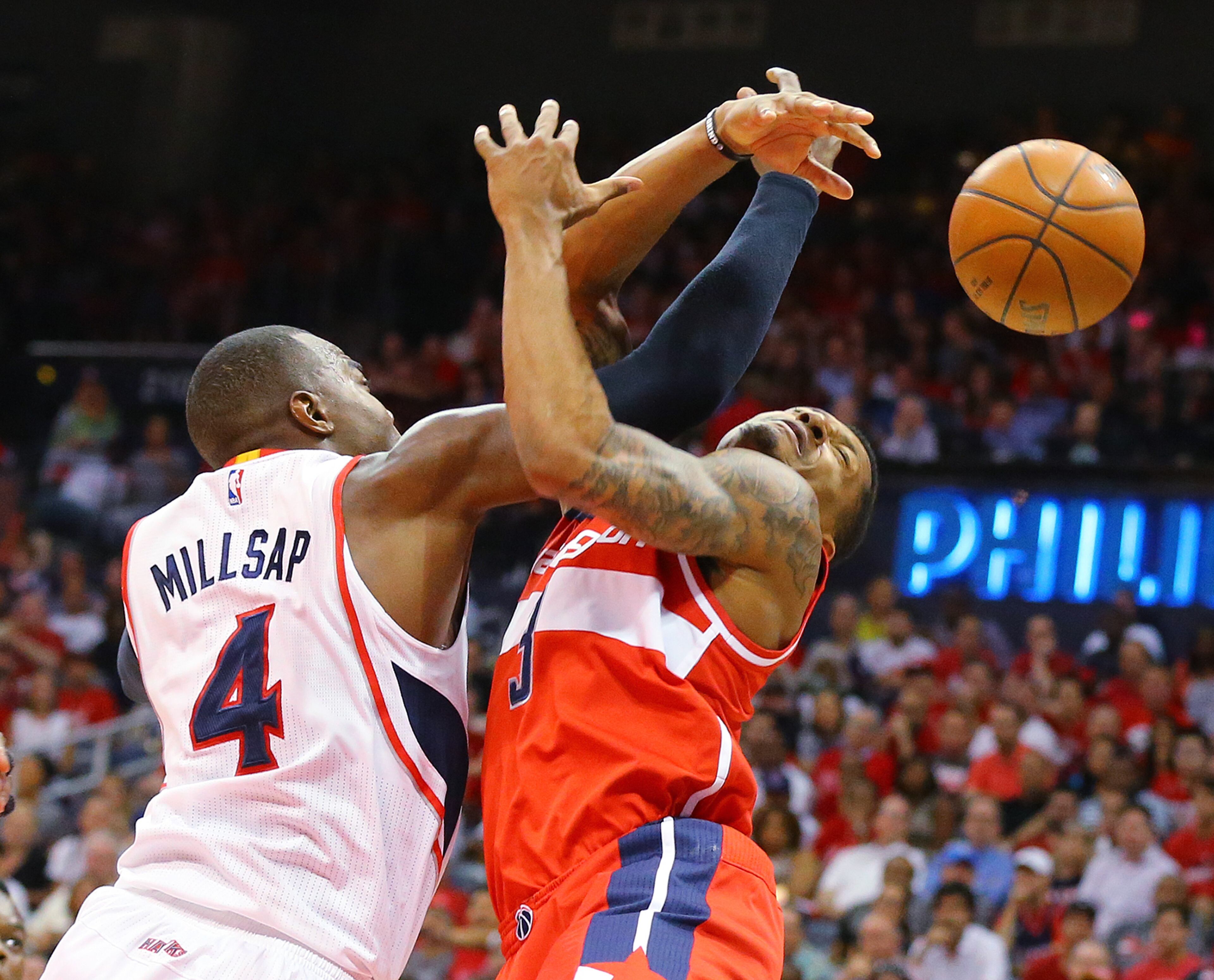 Hawks Paul Millsap knocks the ball away from Wizards Bradley Beal for a Hawks steal in their Eastern Conference Semifinals game 5 on Tuesday, May 13, 2015, in Atlanta. Curtis Compton / ccompton@ajc.com