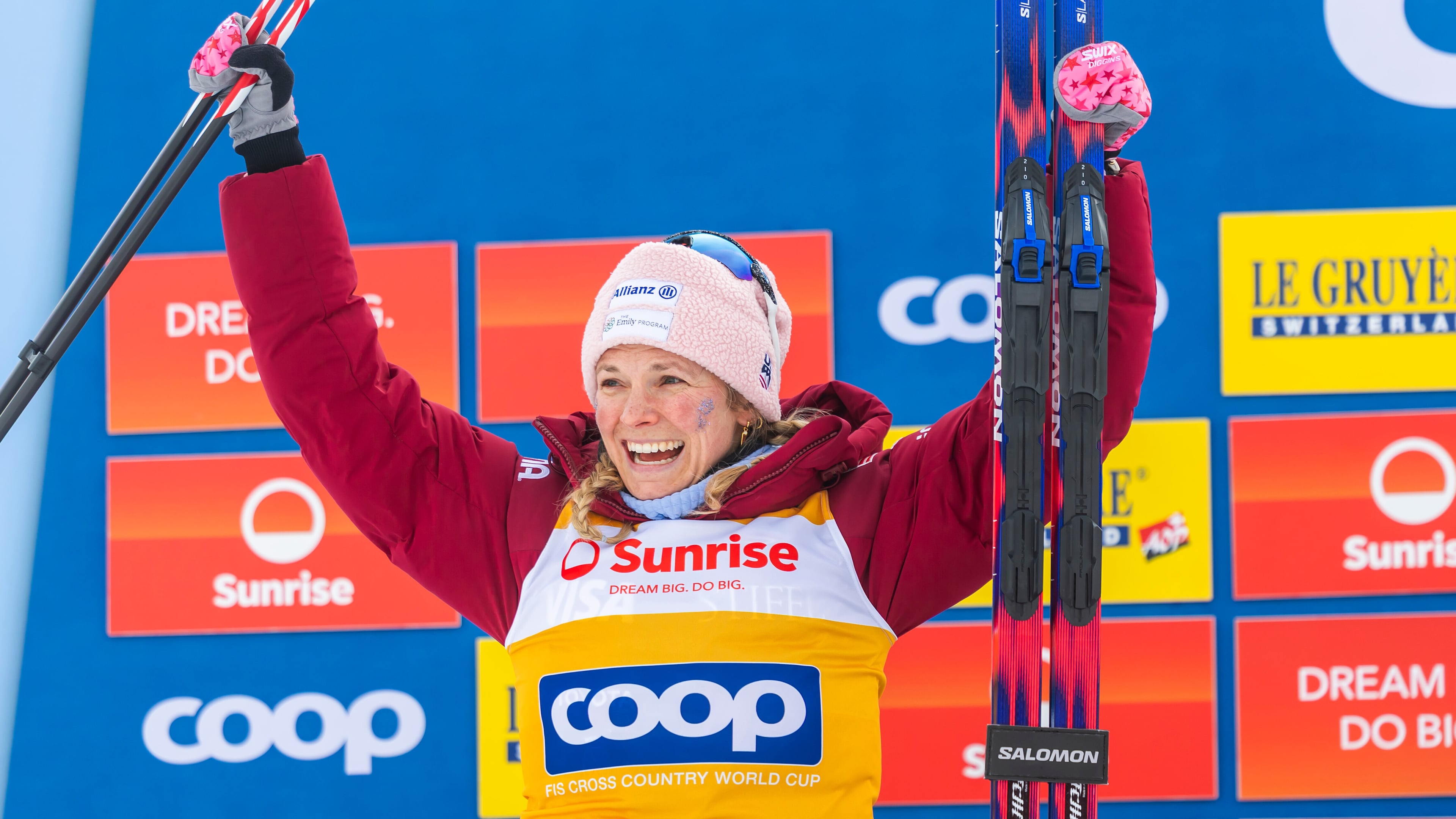 Second placed Jessie Diggins of United States celebrates on the podium after the women's 20km mass start classic skiing race, at the FIS Cross-Country World Cup at the Nordic Center Goms, in Geschinen, Switzerland, Sunday, Jan. 25, 2026. (Salvatore Di Nolfi/Keystone via AP)