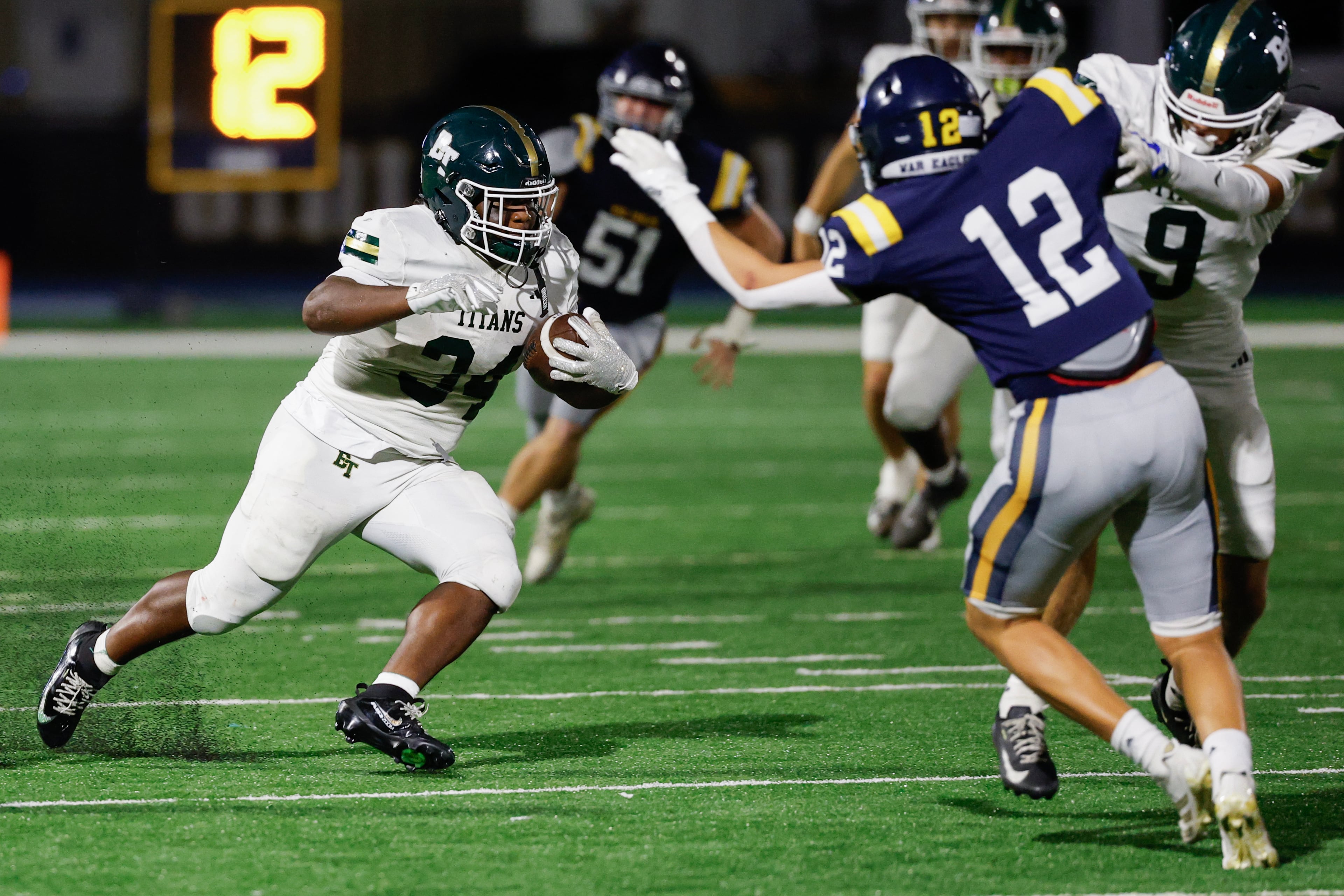 Blessed Trinity running back MJ Craft (left) runs against Marist’s Bobby Harpring during their game on Friday, Sept. 25, 2026, in Atlanta. (Erik S. Lesser for the AJC)