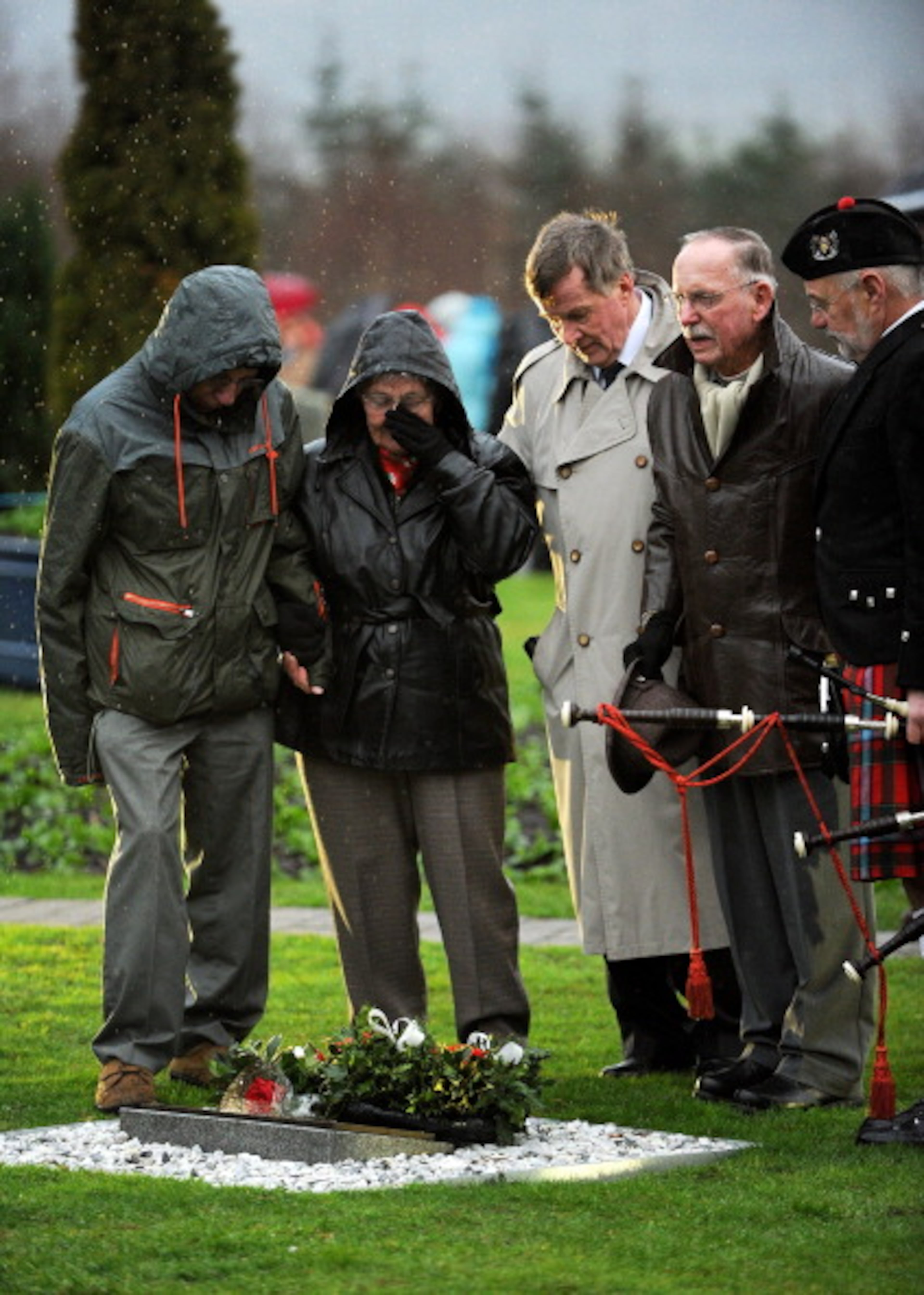 LOCKERBIE, SCOTLAND - DECEMBER 21: Families, relatives and dignitaries gather to pay their respects at the memorial service in Dryfesdale cemetery to commemorate the 25th anniversary of the air disaster on December 21, 2013 in Lockerbie, Scotland. Pan Am Flight 103 exploded over Lockerbie on December 21st, 1988, killing all those on board and a further eleven on the ground. (Photo by Ian Forsyth/Getty Images)