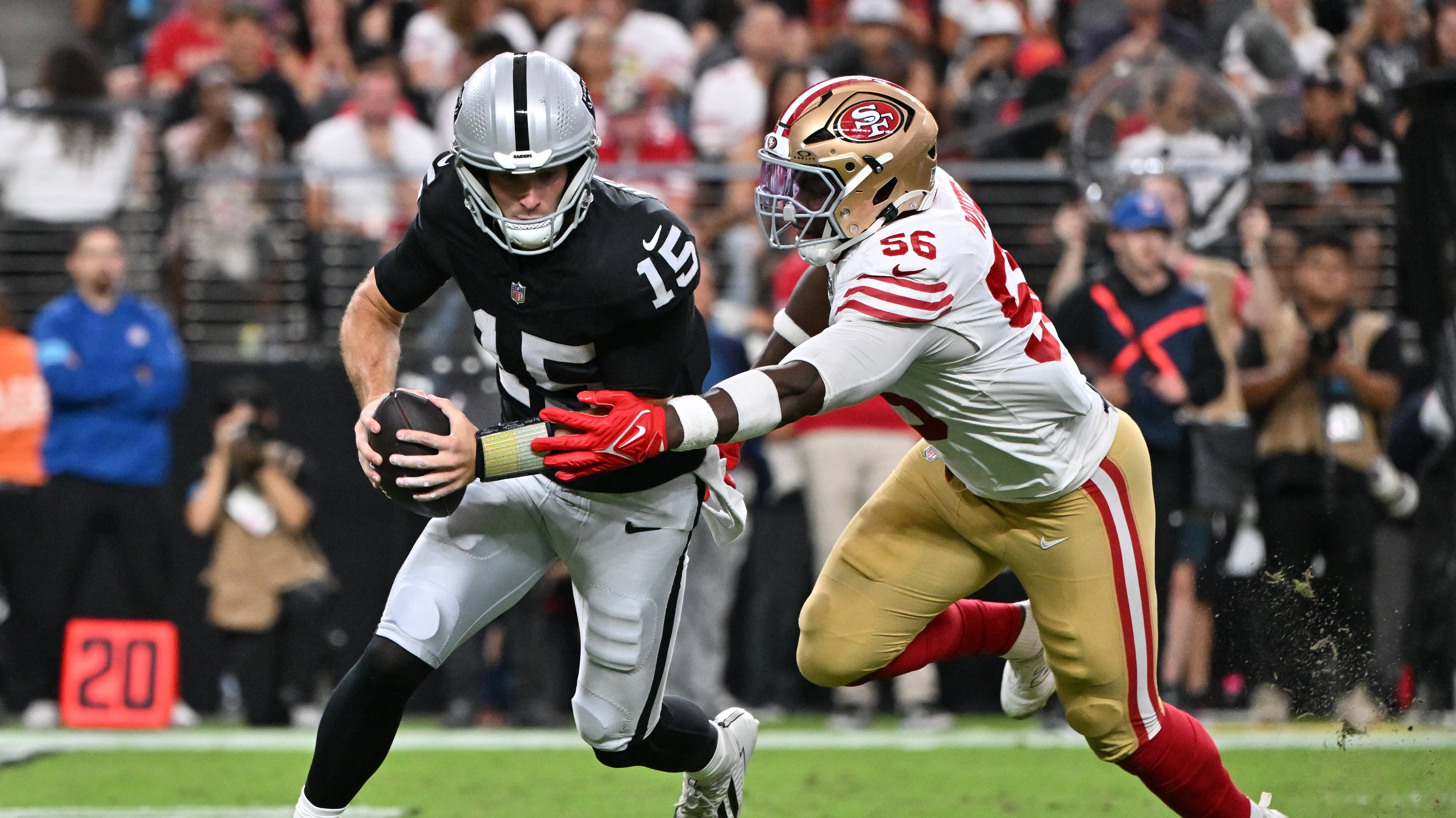 San Francisco 49ers defensive end Keion White (56) sacks Las Vegas Raiders quarterback Fernando Mendoza (15) during the first half of an NFL preseason football game, Thursday, Aug. 27, 2026}, in Las Vegas. (AP Photo/David Becker)