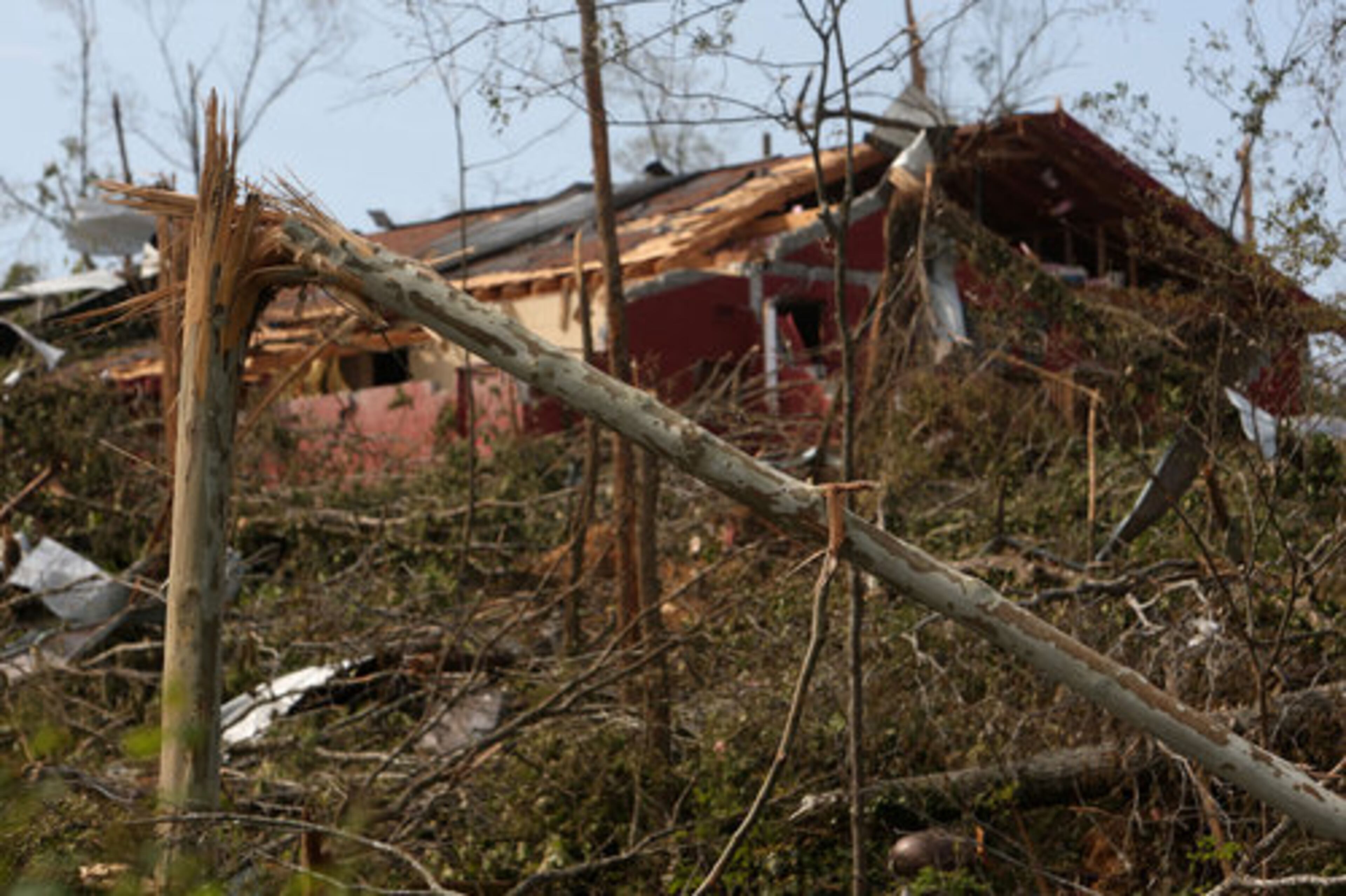 Across from Crowe Springs Baptist Church which held their service at their parking lot, tornadoes from last week seared off trees, flattened homes, and ravaged landscapes in Cartersville, May 1, 2011.
