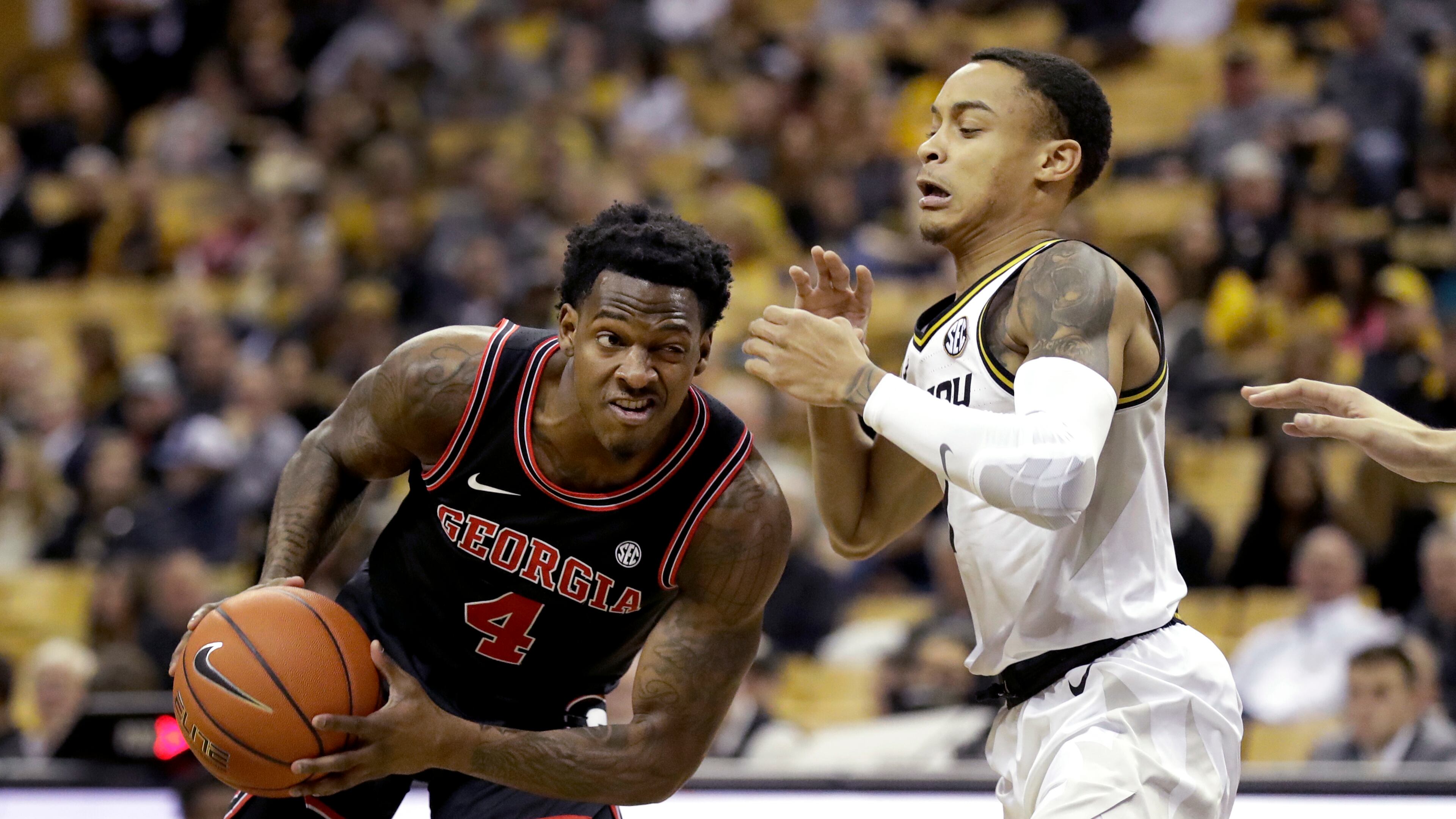 Georgia's Tyree Crump (left) heads to the basket as Missouri's Xavier Pinson defends during the first half of an NCAA college basketball game Tuesday, Jan. 28, 2020, in Columbia, Mo. (AP Photo/Jeff Roberson)