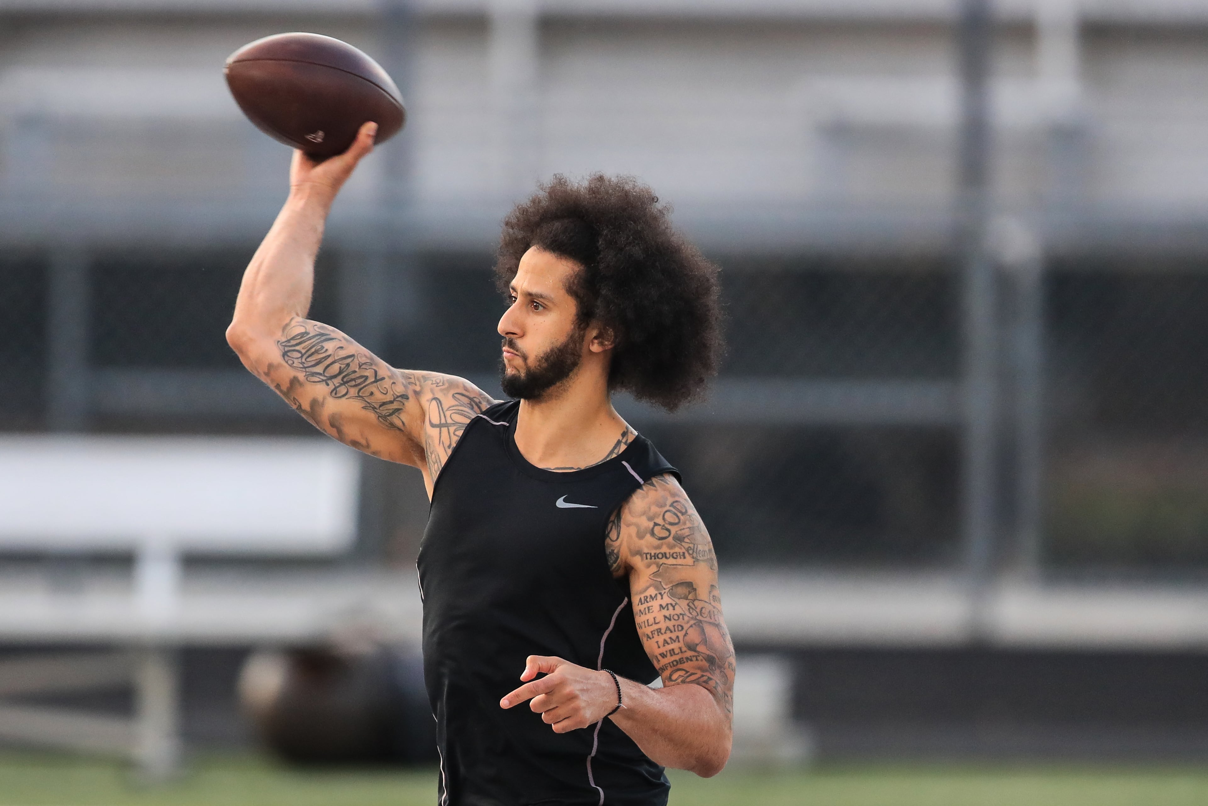 Colin Kaepernick makes a pass during a private NFL workout held at Charles R Drew high school on November 16, 2019 in Riverdale, Georgia. Due to disagreements between Kaepernick and the NFL the location of the workout was abruptly changed. (Photo by Carmen Mandato/Getty Images)