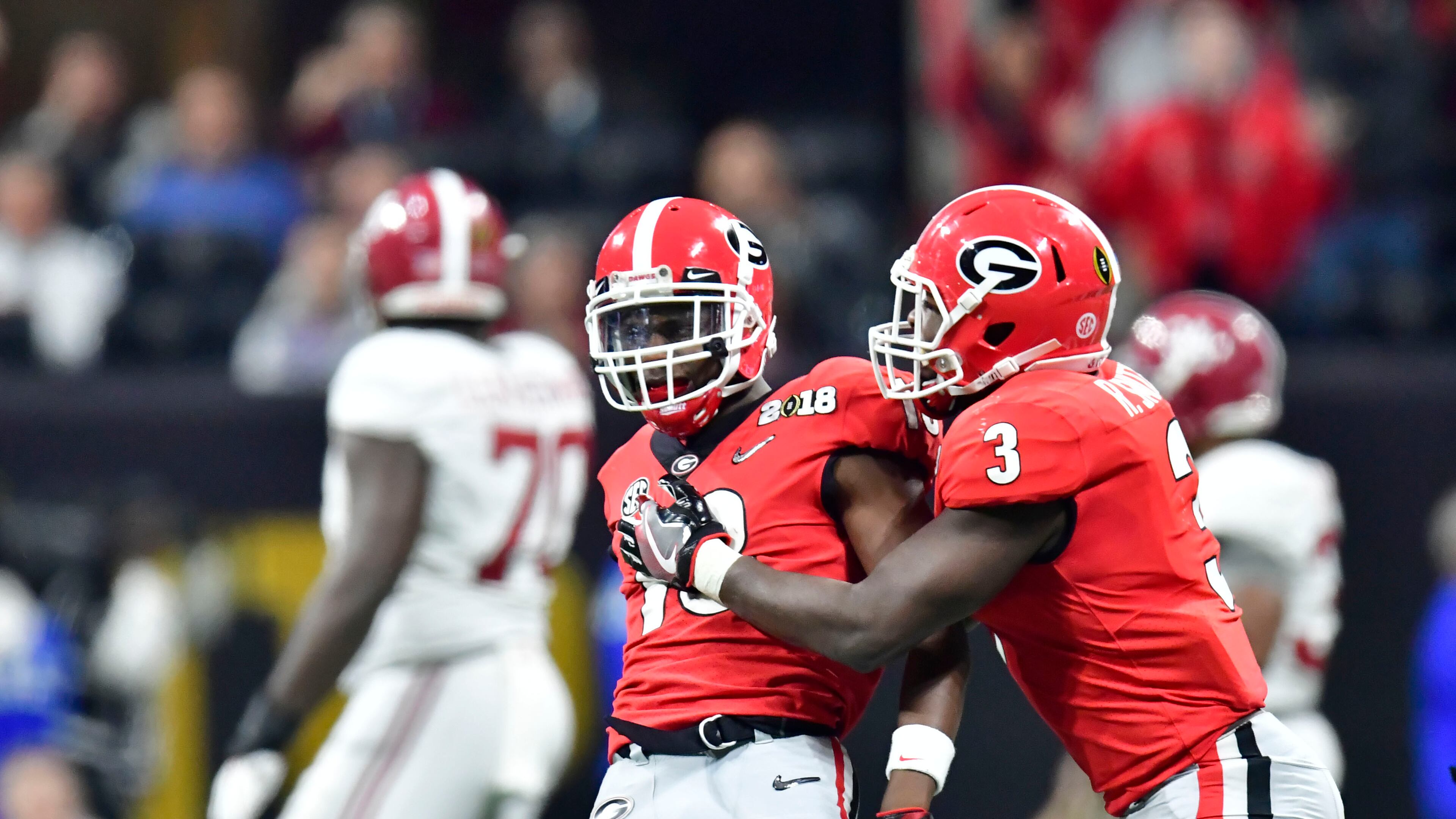 January 8, 2018 Atlanta - Georgia defensive back Deandre Baker (18) and Georgia linebacker Roquan Smith (3) celebrate in the second half during College Football Playoff National Championship at Mercedes-Benz Stadium on Monday, January 8, 2018. Alabama came back from a 13-point second half deficit after switching to the young quarterback in a dramatic 26-23 overtime victory over Georgia in the college football title game Monday night at Mercedes-Benz Stadium. HYOSUB SHIN / HSHIN@AJC.COM