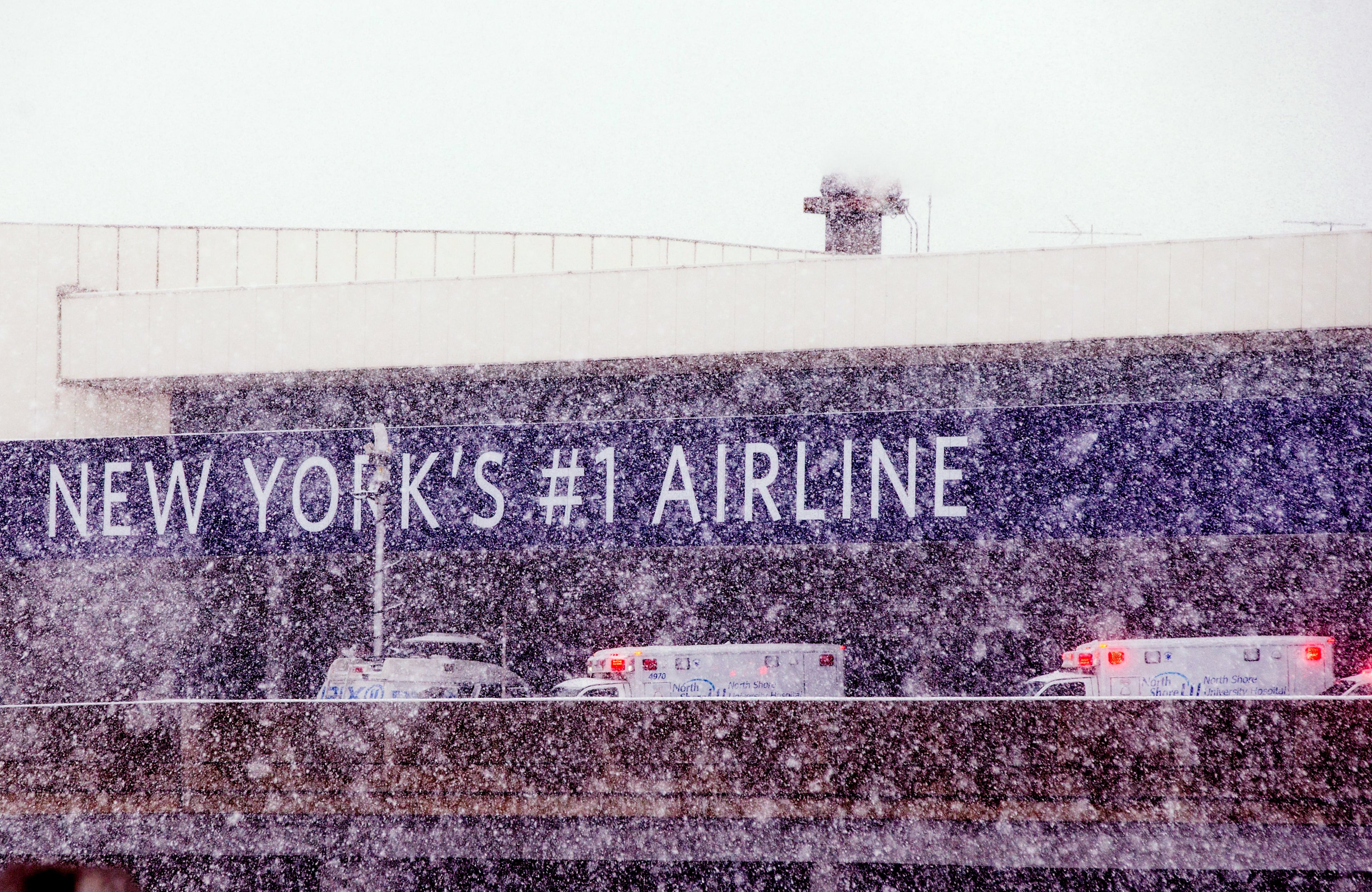 NEW YORK, NY - MARCH 5: Ambulances are parked at the terminal March 5, 2015 at LaGuardia Airport in the Queens borough of New York City. A Delta jet partially skidded off a runway at the airport while trying to land in a snowstorm. (Photo by Andrew Theodorakis/Getty Images).