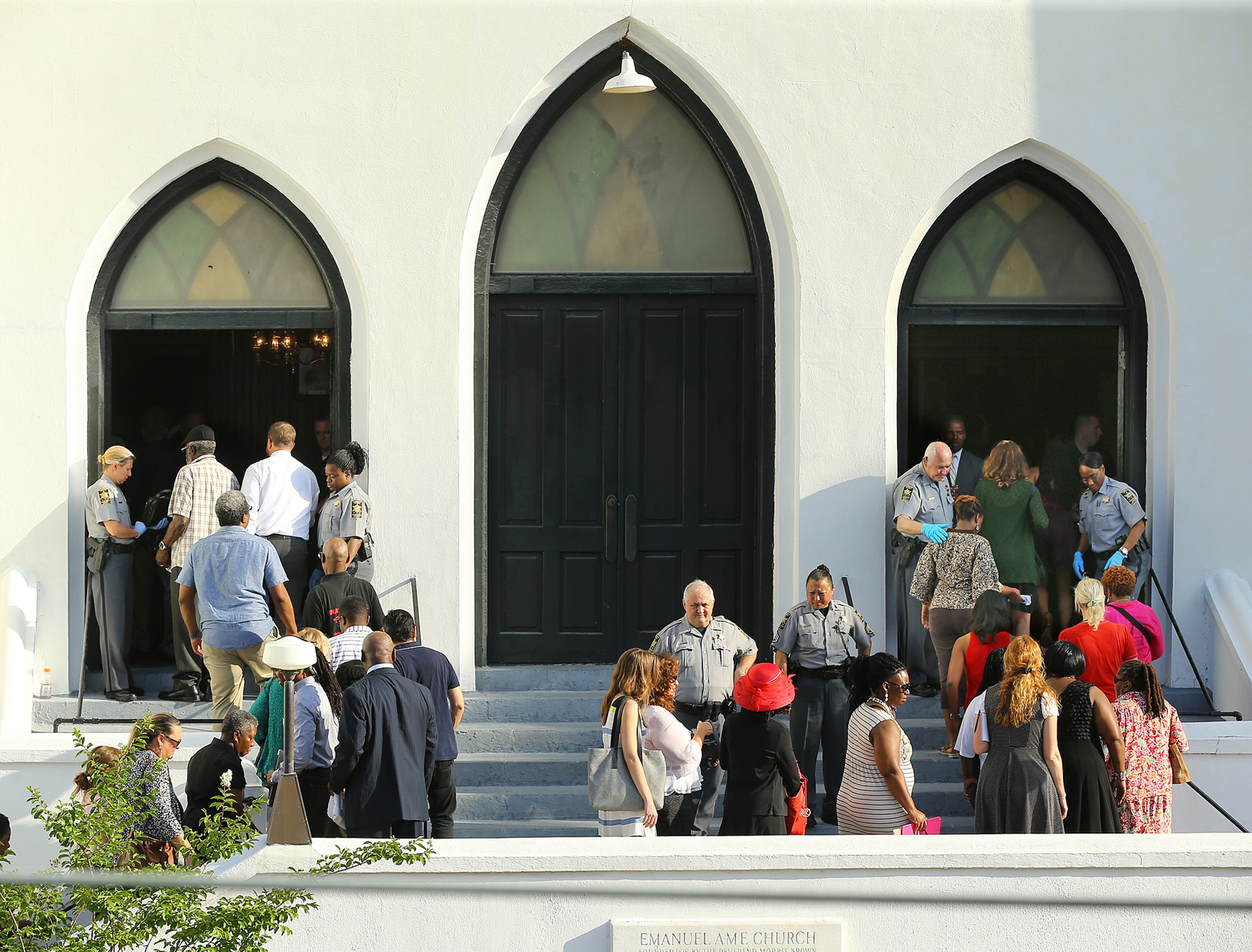 The doors reopen for church service at the "Mother" Emanuel AME. Church four days after the mass shooting that claimed the lives of its pastor and eight others on Sunday, June 21, 2015, in Charleston. Curtis Compton / ccompton@ajc.com