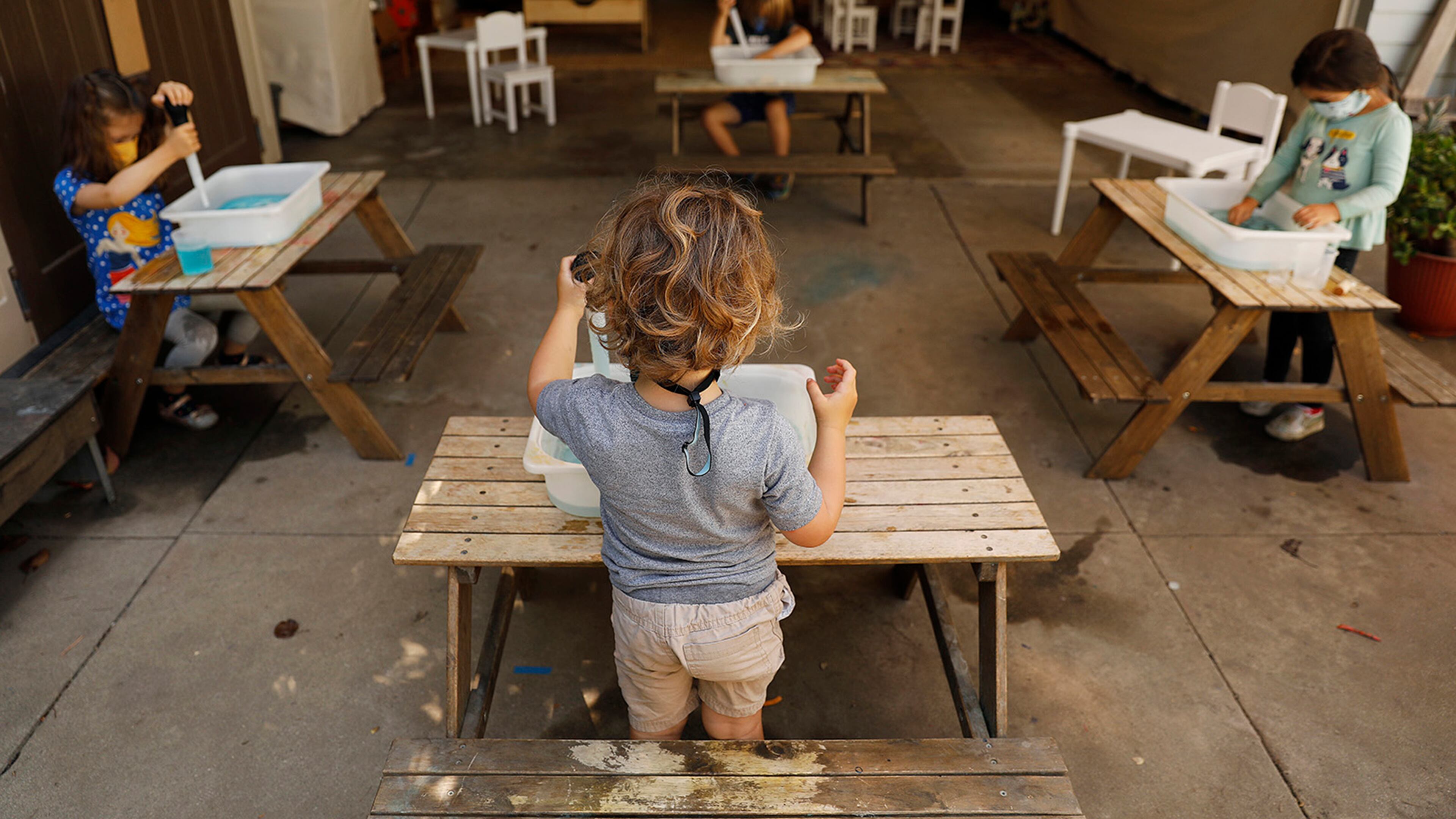 Children do activities at separate tables at Voyages Preschool in Los Angeles, Calif. on Thursday, August 27, 2020. Christina House/Los Angeles Times/TNS