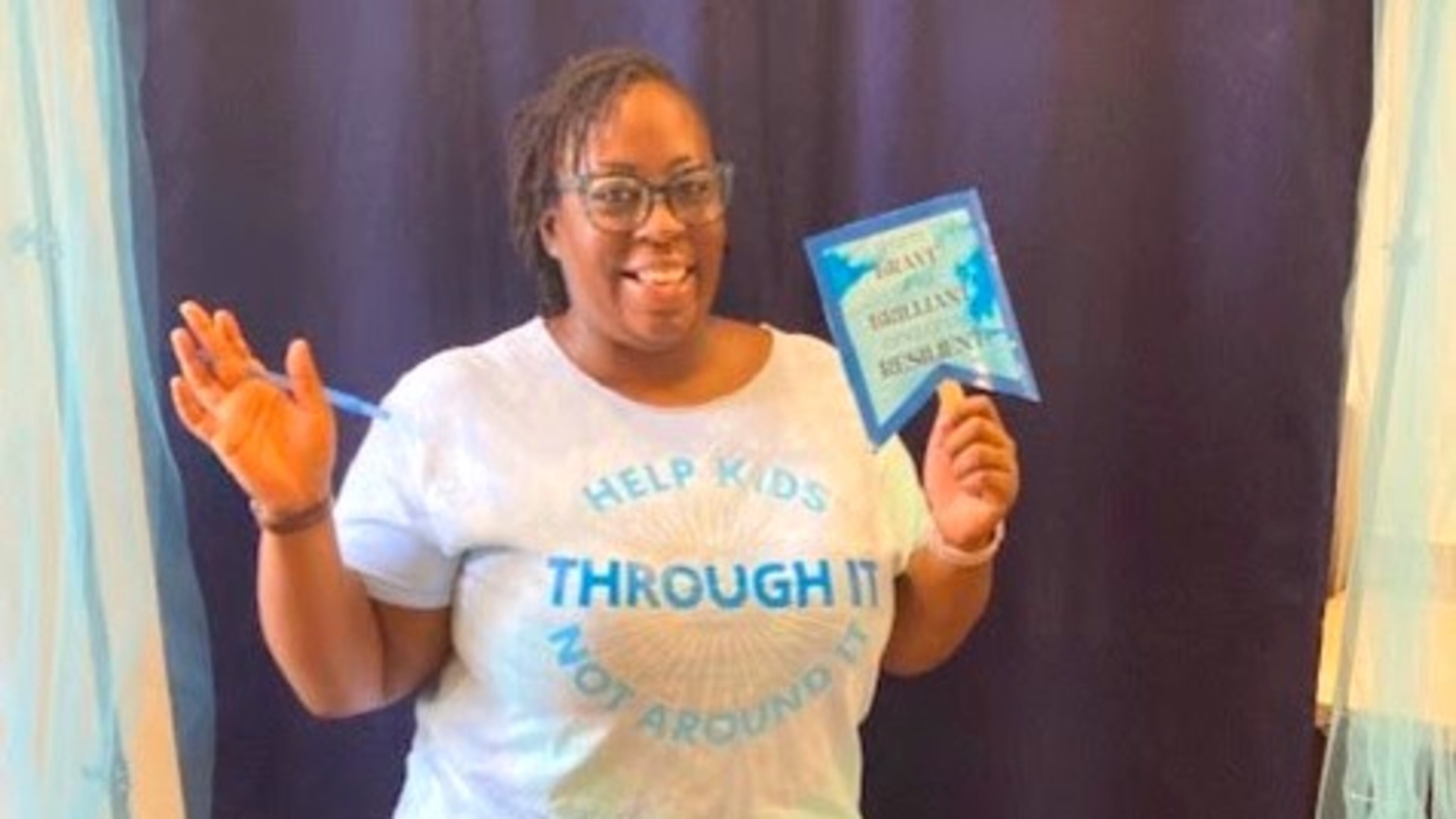 Working with local librarians, like Erica in this photo, Strong4Life has curated a list of books which have themes related to resilience and then developed a list of reflection questions so caregivers and children can talk about these issues together. COURTESY CHILDREN'S HEALTHCARE OF ATLANTA STRONG4LIFE