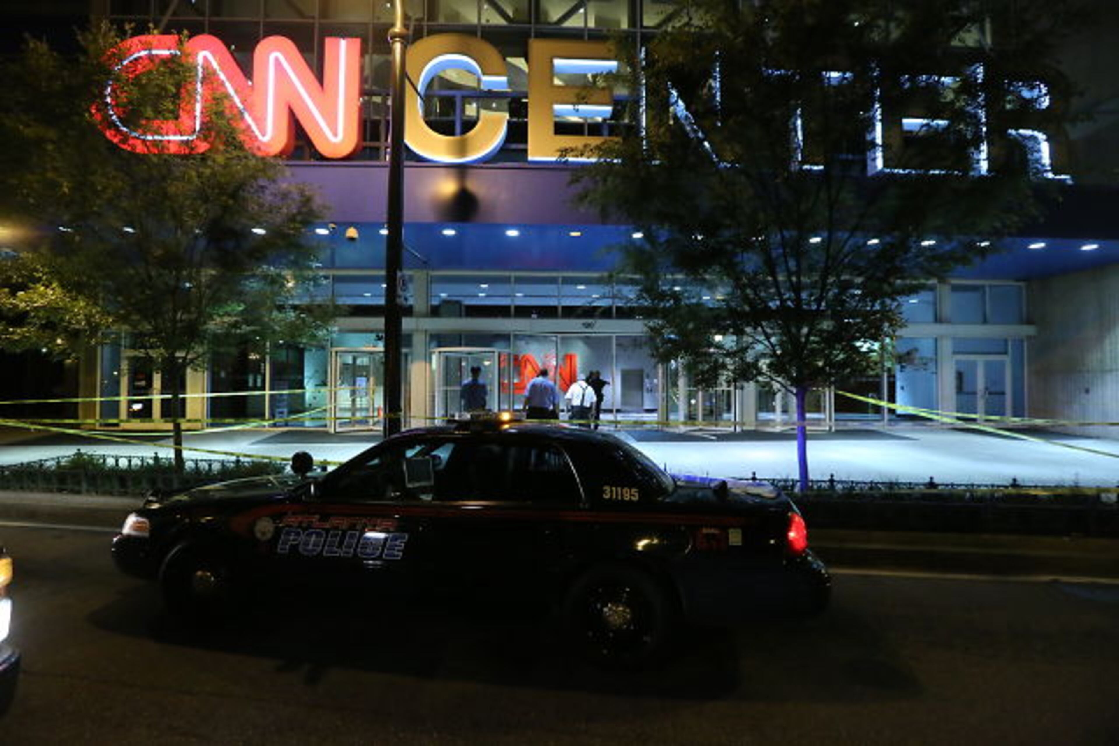 The Mercedes-Benz convertible crashed through the glass facade on the Marietta Street side of the building shortly after 4 a.m. JOHN SPINK/JSPINK@AJC.COM