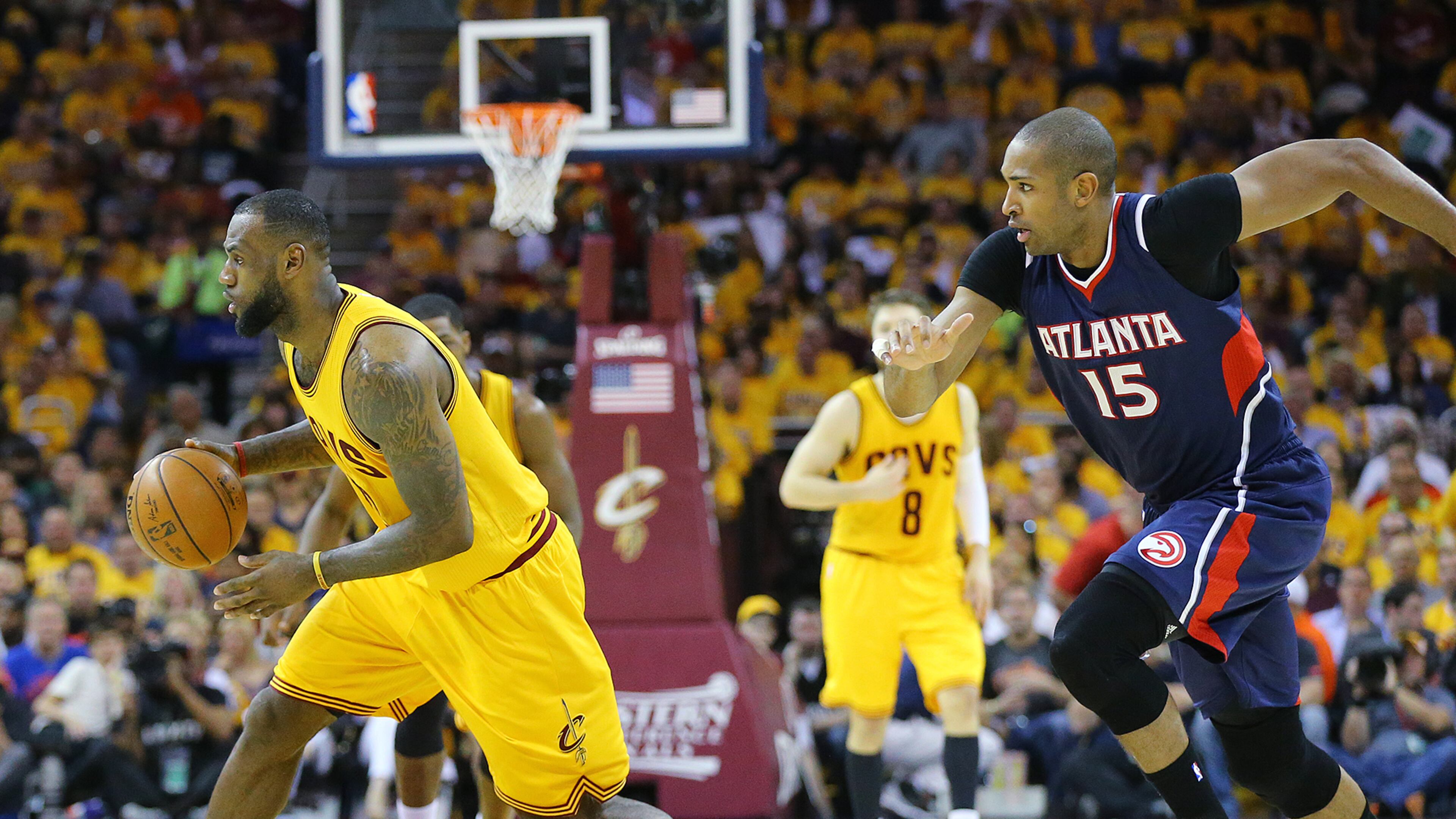 Cavaliers LeBron James steals from the Hawks with Al Horford in pursuit in the Eastern Conference Finals on Sunday, May 24, 2015, in Cleveland. Curtis Compton / ccompton@ajc.com