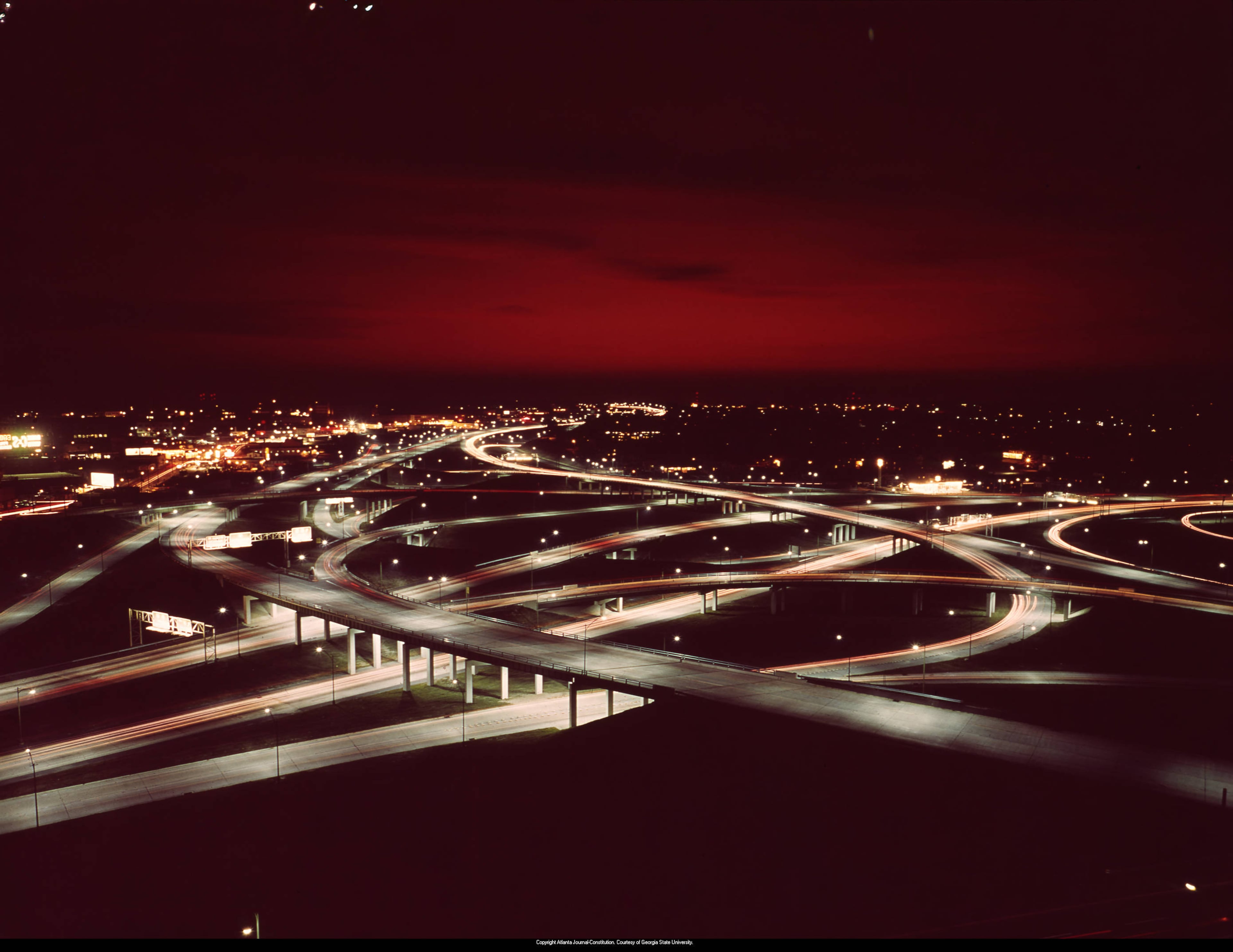 Time-lapse night photo of Atlanta's various highways converging at late sunset, October 1964.