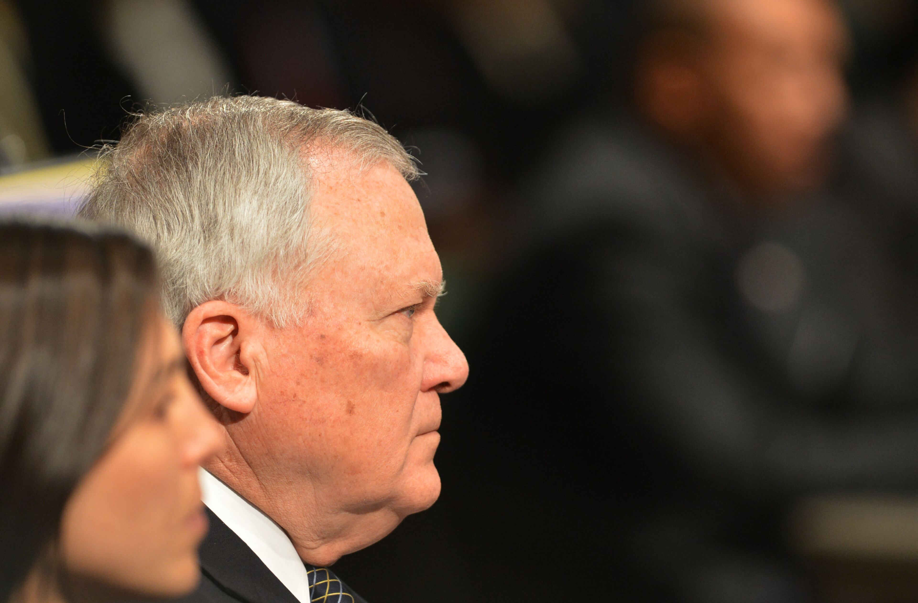 Gov. Nathan Deal listens as Dr. Mark Elgart, CEO of AdvancED makes a presentation before the DeKalb County School Board and a standing room only crowd Tuesday, January 21, 2014. The Southern Association of Colleges and Schools has cleared the DeKalb school district from its probationary status saying the threat to its accreditation is no longer eminent. However, Elgart, the SACS chief, says the district is still under watch and they are now under something called accreditation warning. Gov. Nathan Deal was also there to applaud the school district on its progress. Deal removed six board members last year after the district was placed on probation for mismanagement. KENT D. JOHNSON/KDJOHNSON@AJC.COM