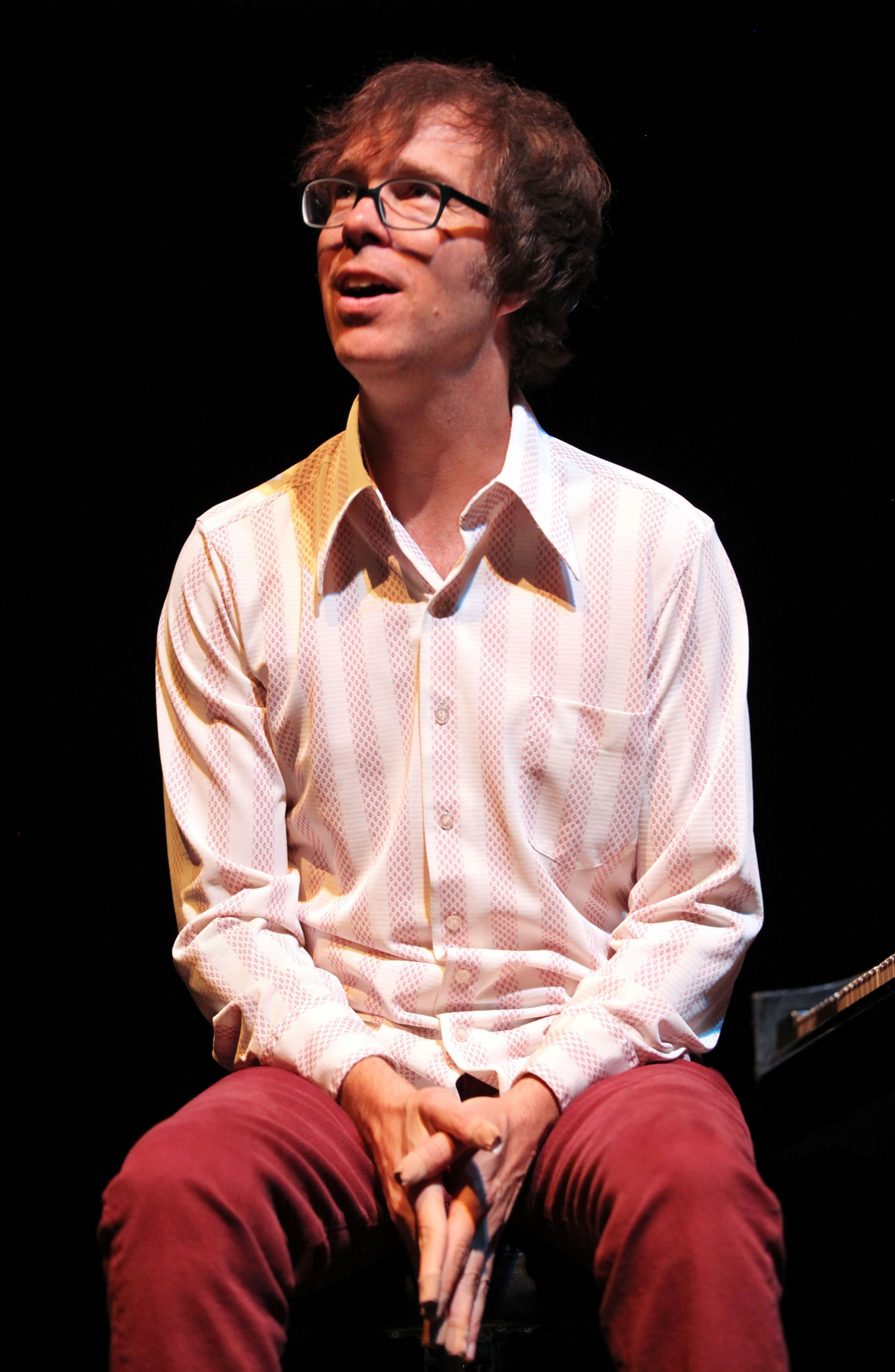 Folds talks to the crowd.