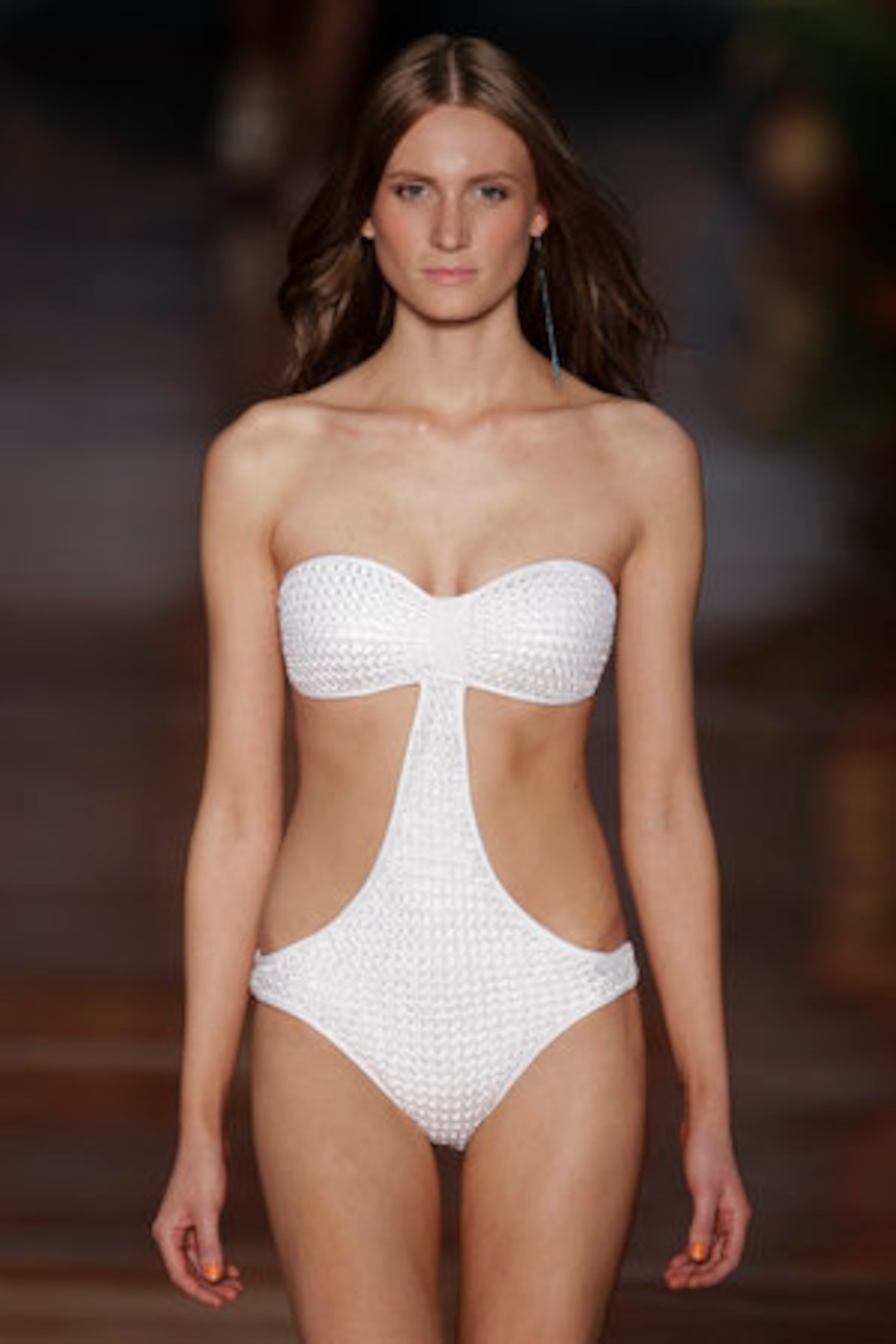 A model sports a Blue Man-designed swimsuit.