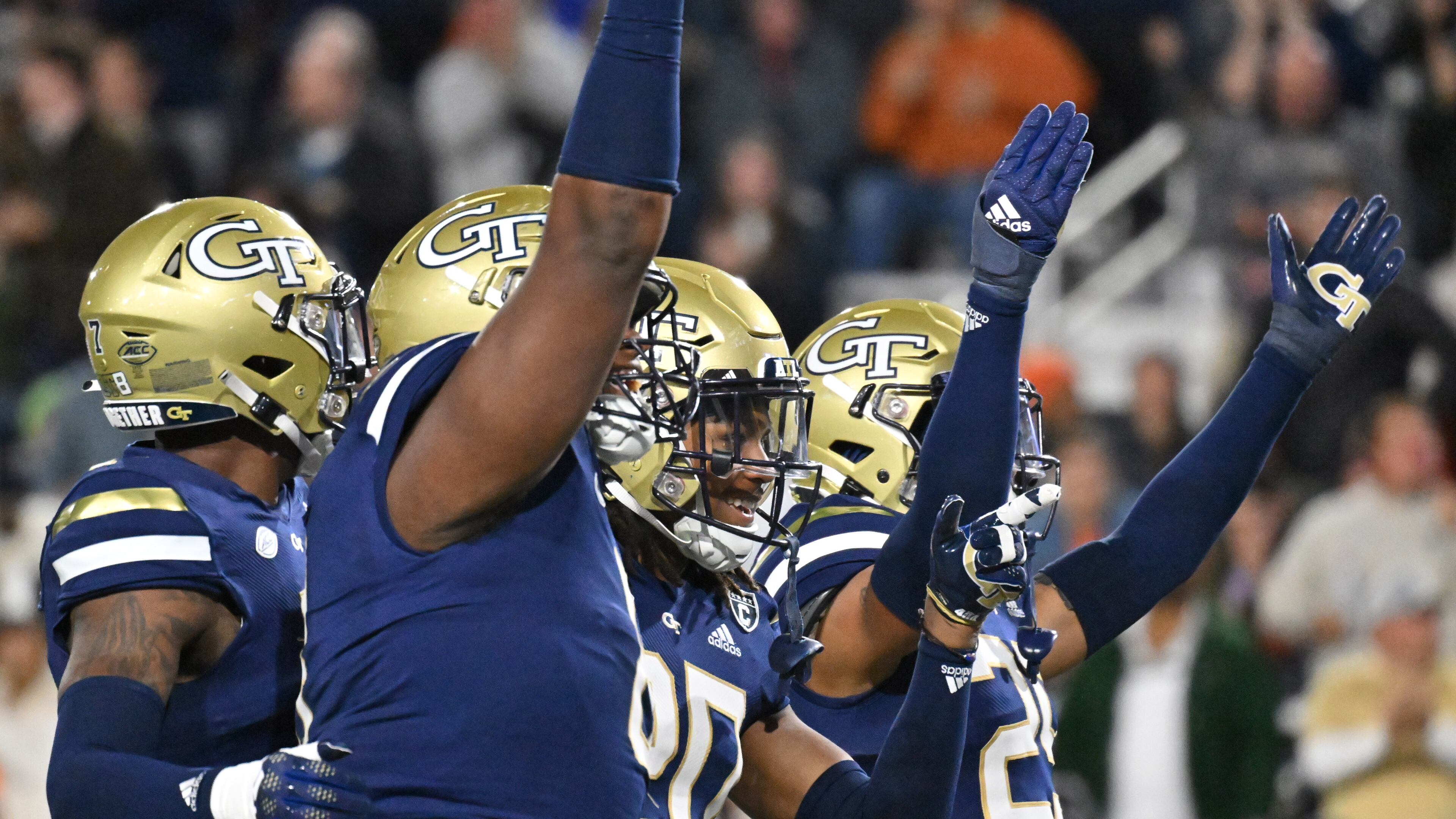 Georgia Tech safety LaMiles Brooks (20) celebrates with teammates after scoring a touchdown during the first half against Virginia last Thursday in Atlanta. (Hyosub Shin / Hyosub.Shin@ajc.com)