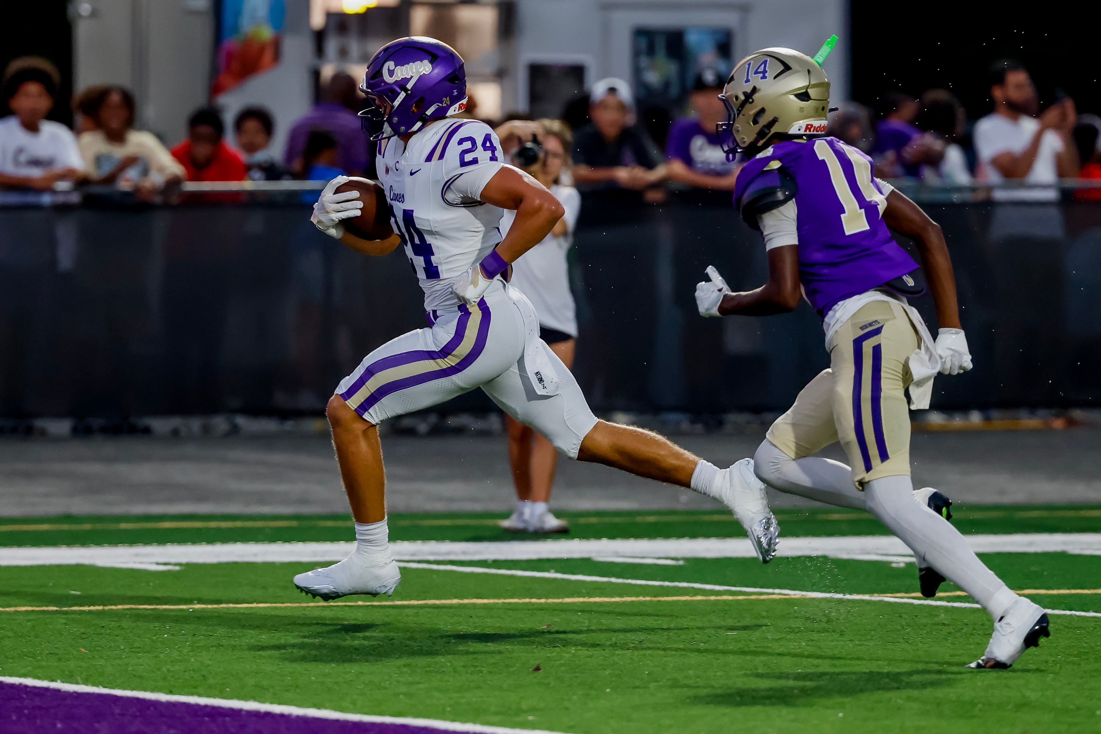 Carterville tight end Cole Crawford (left) runs past Hiram cornerback Roman Hunt for a touchdown on Friday, Aug. 21, 2026, in Hiram. (Erik S. Lesser for the AJC)
