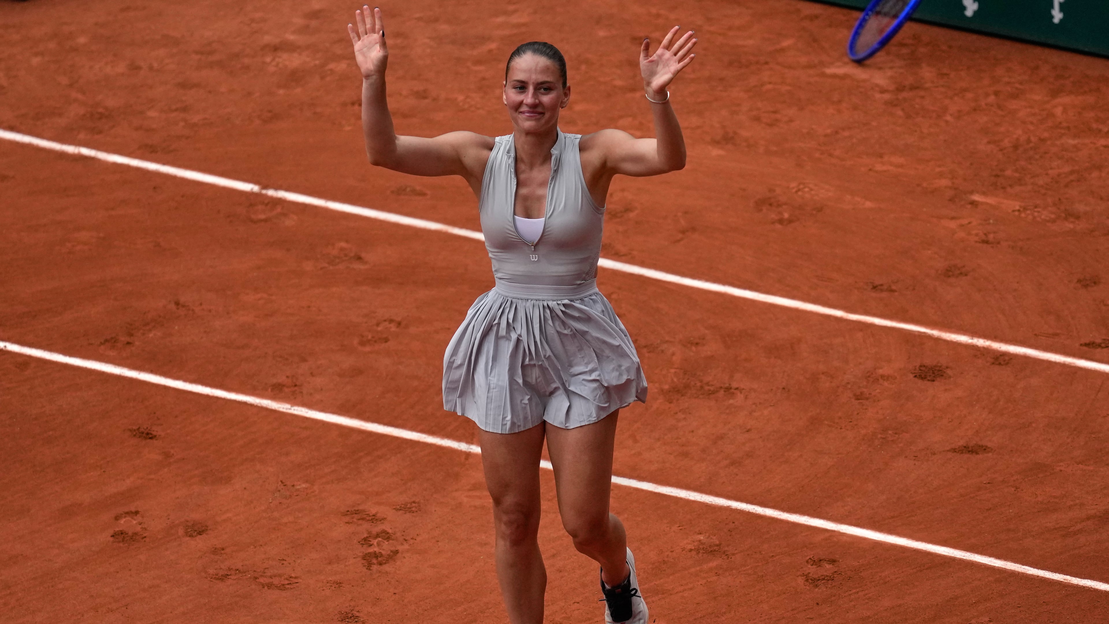 Ukraine's Marta Kostyuk reacts after the fourth-round tennis against Poland's Iga Swiatek match at the French Open in Paris, Sunday, May 31, 2026. (AP Photo/Christophe Ena)