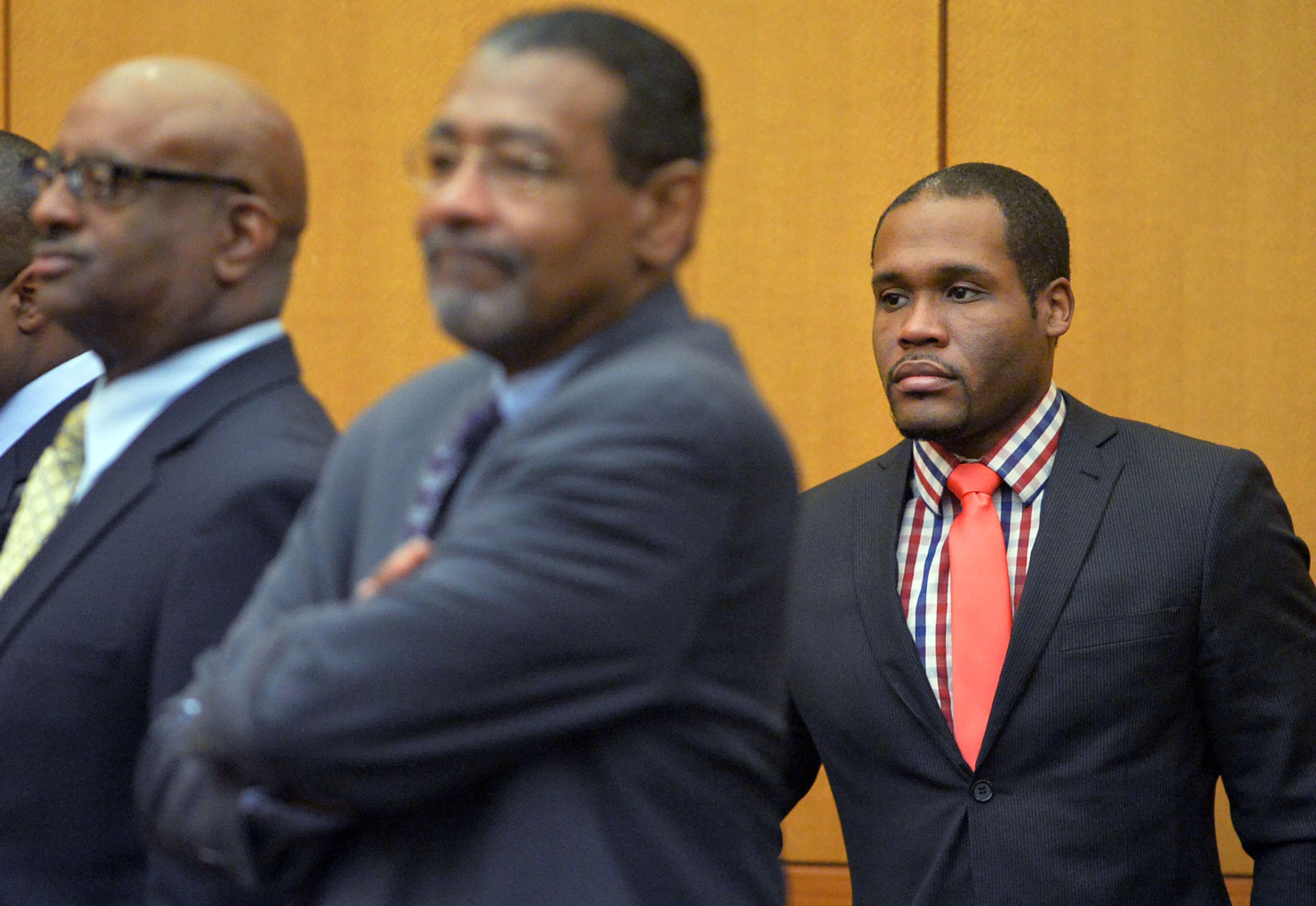 Defense attorney Gerald Griggs (from right), defense attorney George Lawson and his client Michael Pitts, a former APS regional director, stand as the jury enters the courtroom Wednesday in the Atlanta Public Schools test-cheating trial. (Atlanta Journal-Constitution, Kent D. Johnson, Pool)
