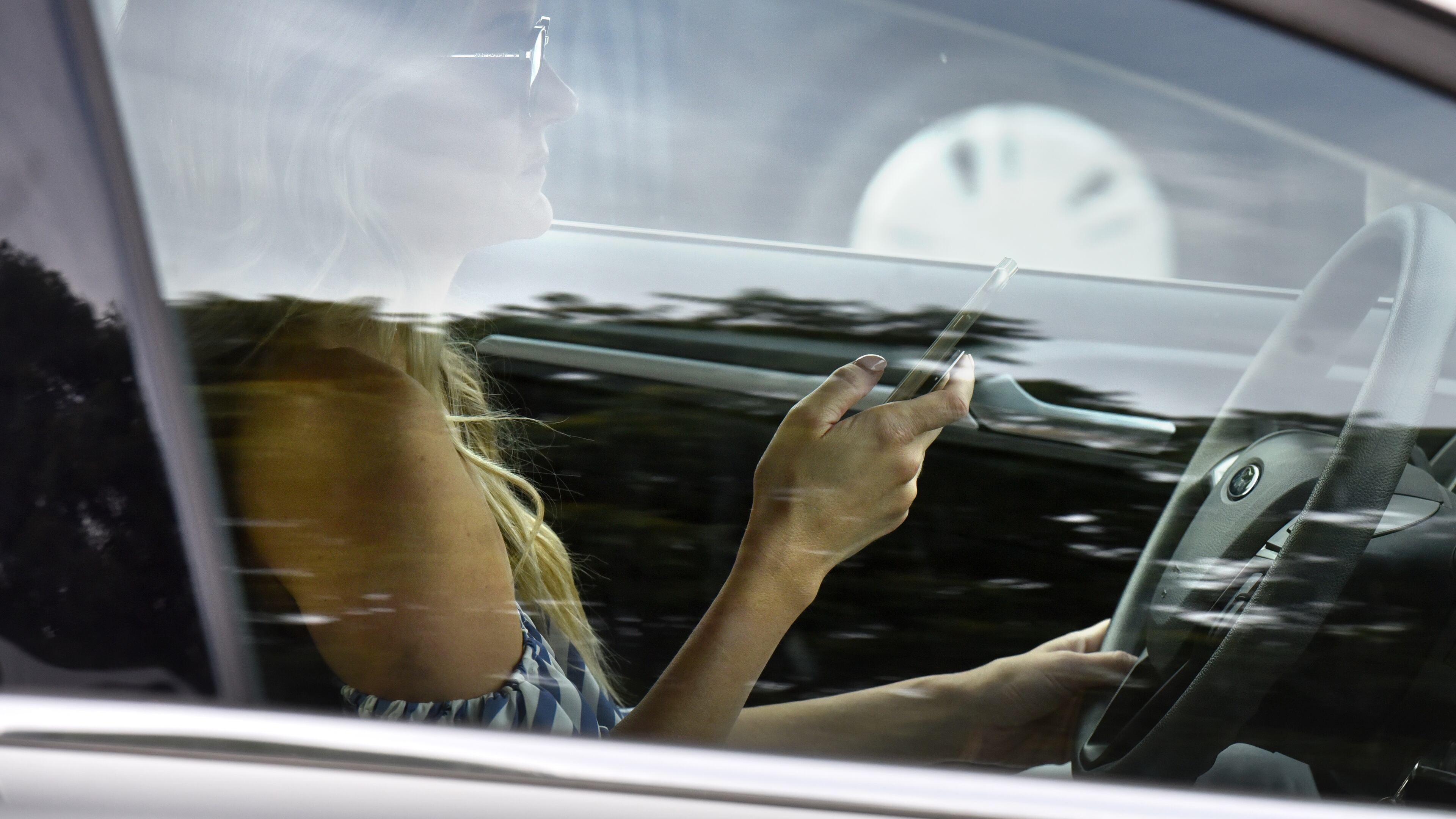 A company analyzed the behavior of Georgia motorists before and after the state's distracted driving law took effect last summer. HYOSUB SHIN / HSHIN@AJC.COM