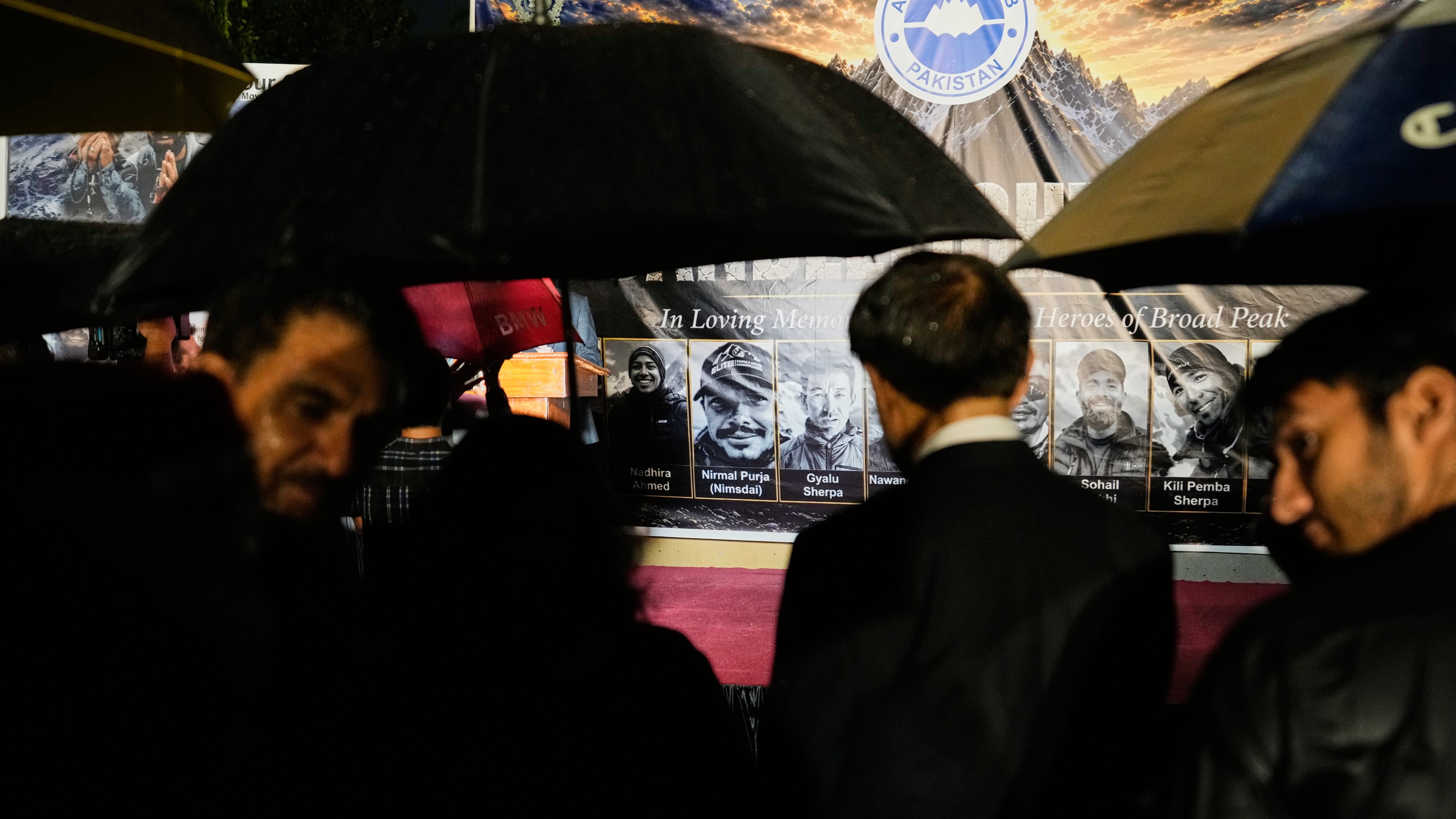 People attend a candlelight vigil in memory of 10 climbers who lost their lives on Broad Peak, in Islamabad, Pakistan, Tuesday, Aug. 11, 2026. (AP Photo/Anjum Naveed)