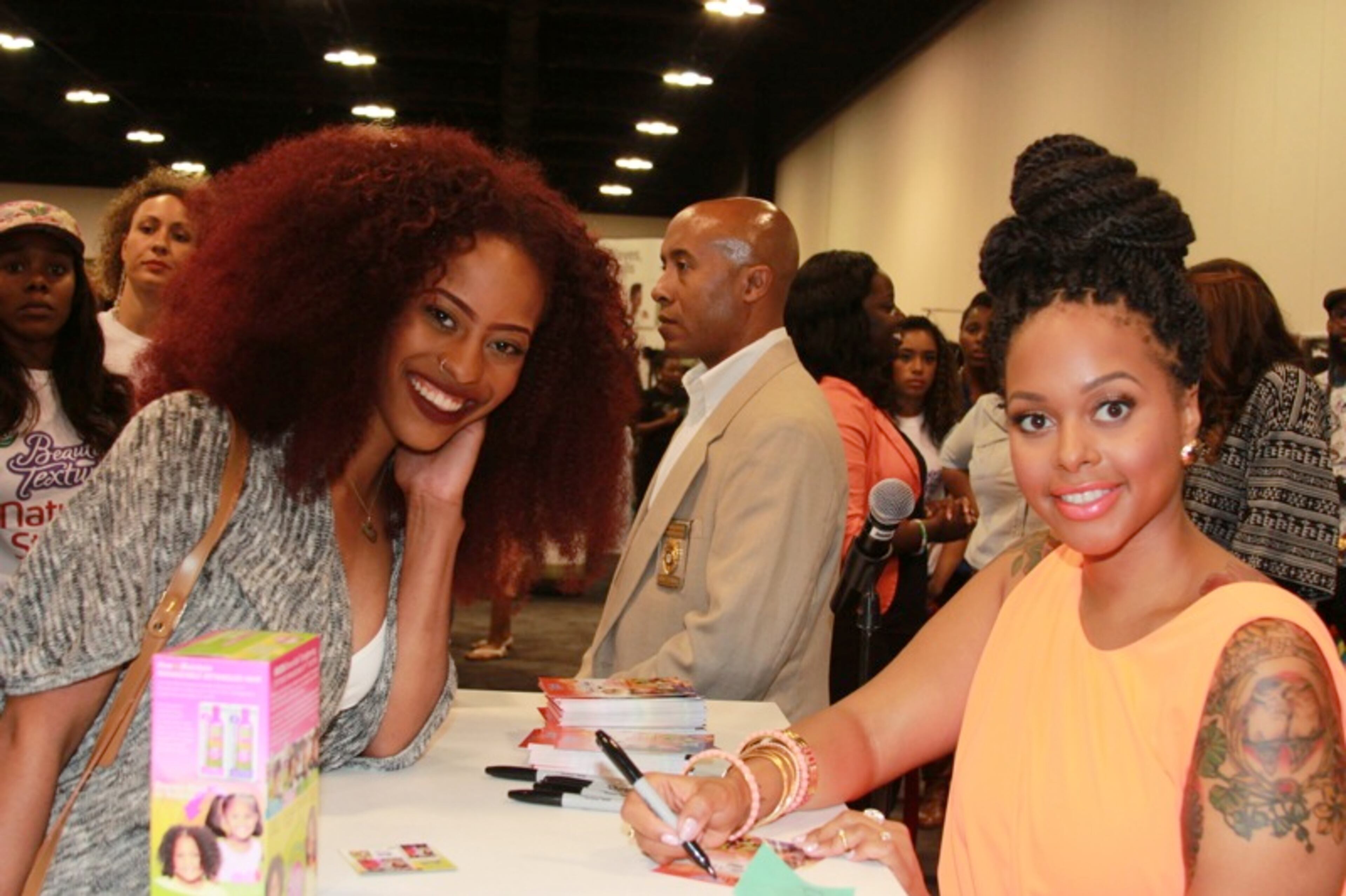 Chrisette Michele signs autographs and poses for pictures with her fans.