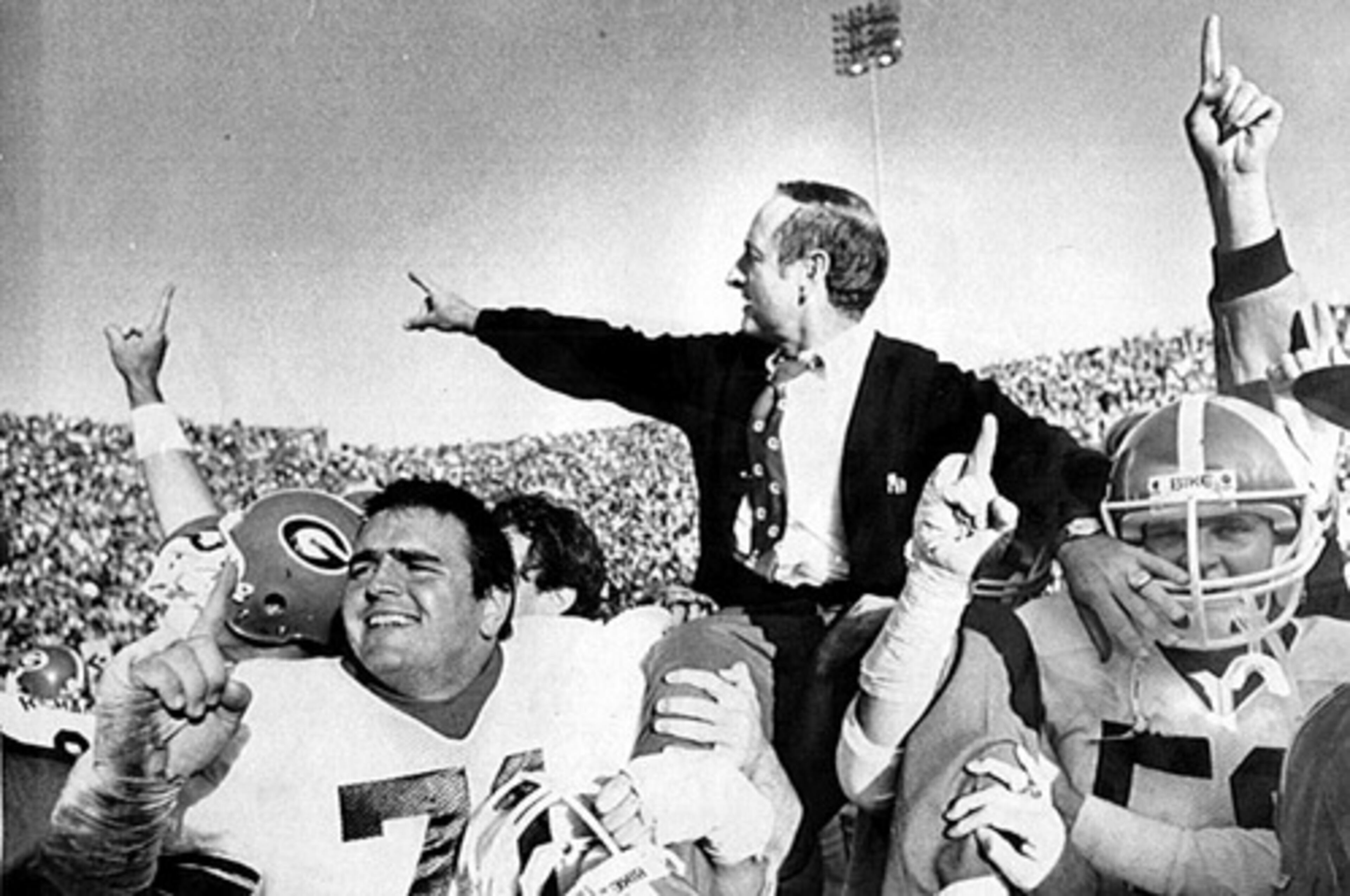 Georgia coach Vince Dooley gets a victor's ride after a 19-14 win at Auburn that clinched the 1982 SEC crown. Dooley was a star player for the Tigers in the 1950s.