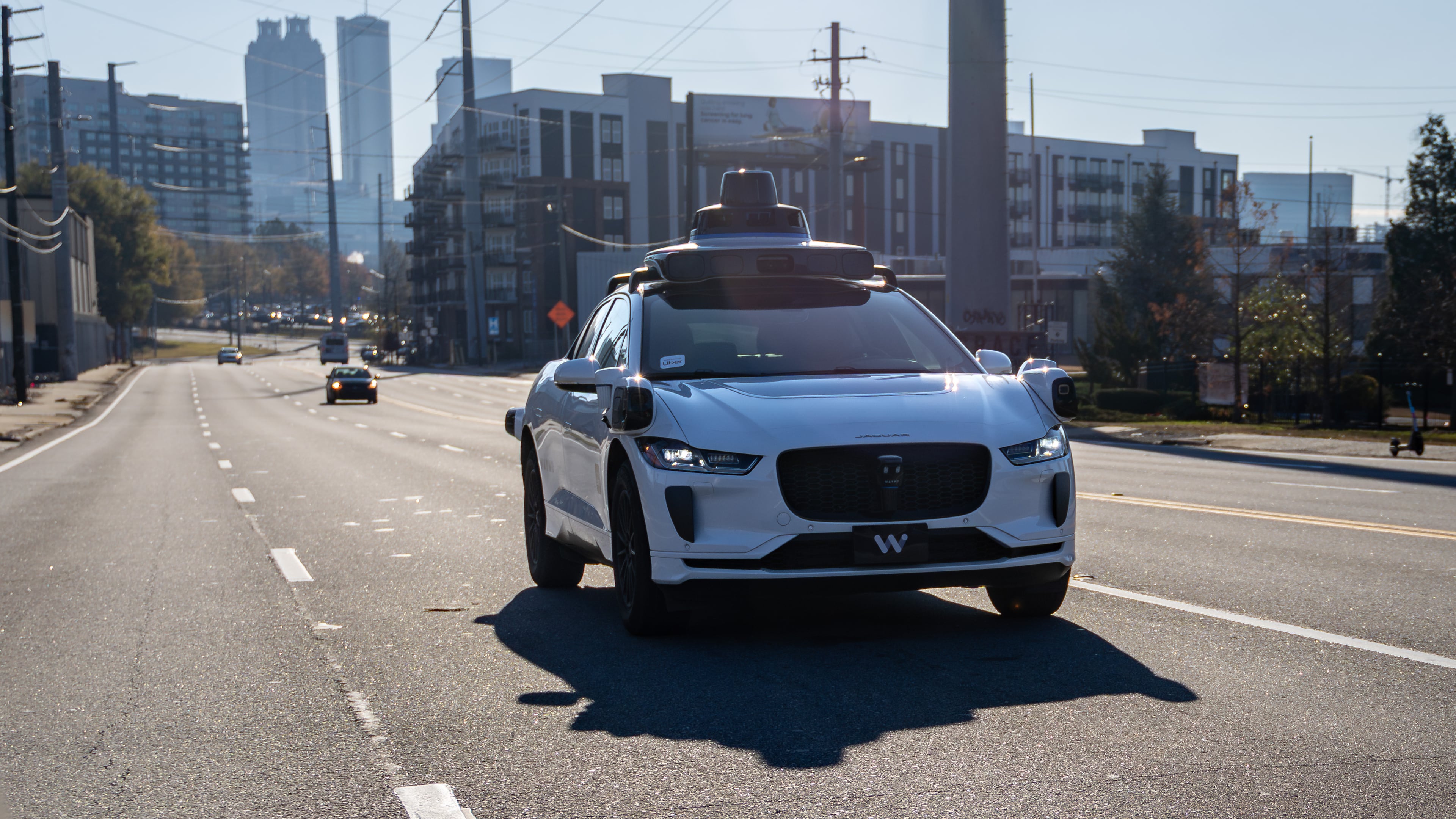 A Waymo self-driving taxi travels down Northside Drive in Atlanta on Thursday, Dec. 11, 2025. (Ben Hendren for the AJC)