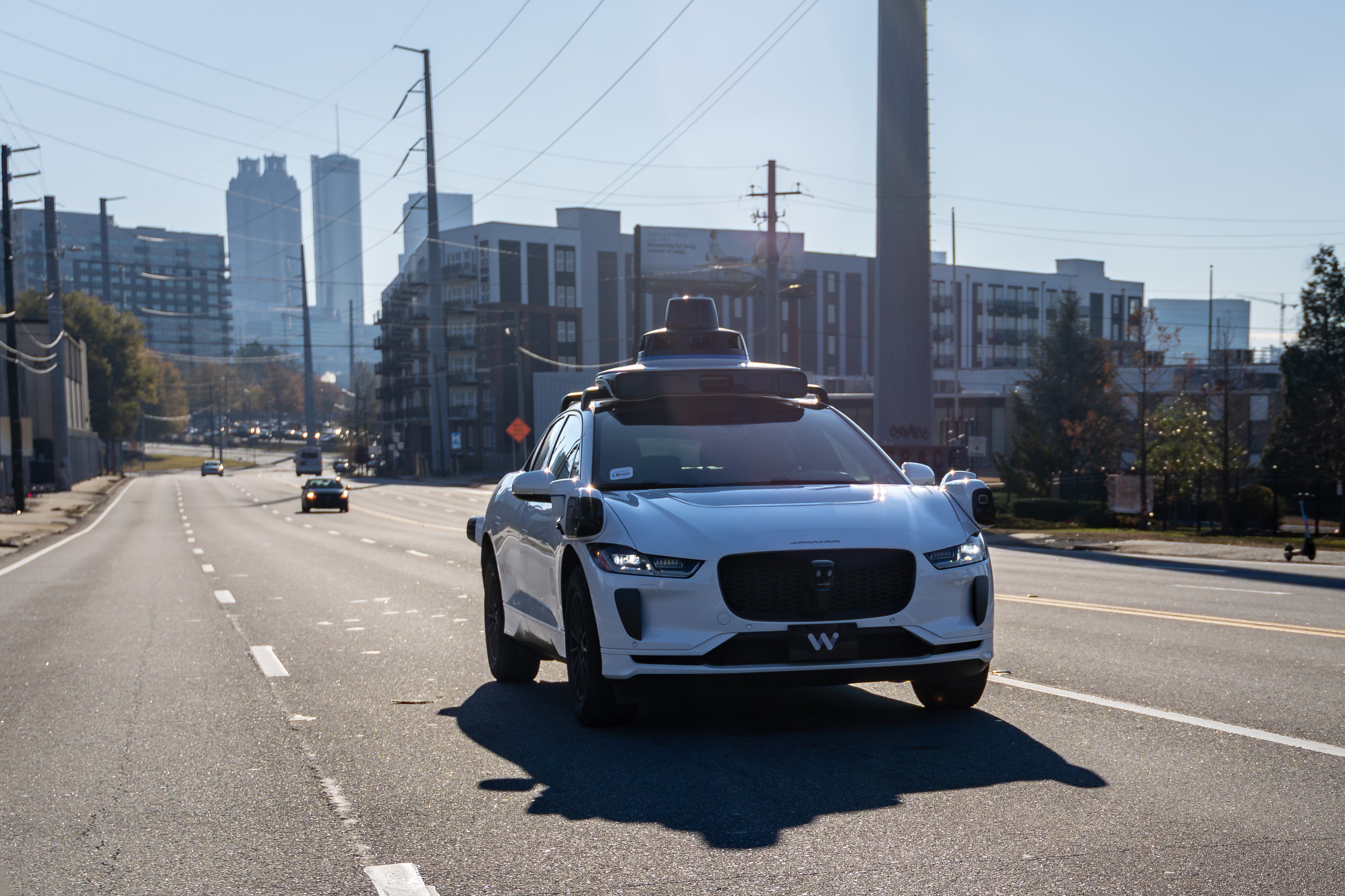 A Waymo self-driving taxi travels down Northside Drive in Atlanta on Thursday, Dec. 11, 2025. (Ben Hendren for the AJC)