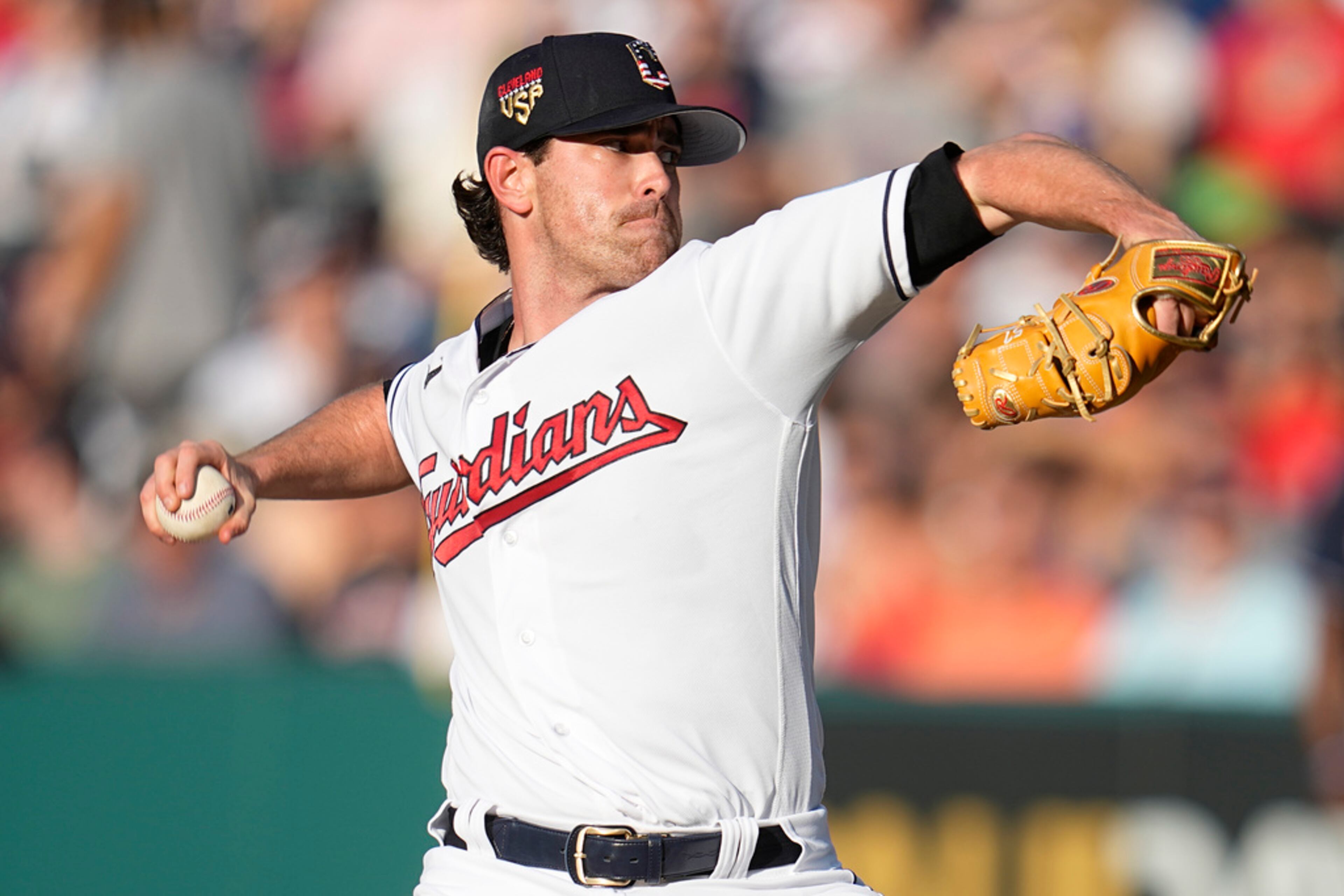Cleveland Guardians' Shane Bieber pitches in the first inning of the team's baseball game against the Atlanta Braves, Tuesday, July 4, 2023, in Cleveland. (AP Photo/Sue Ogrocki)