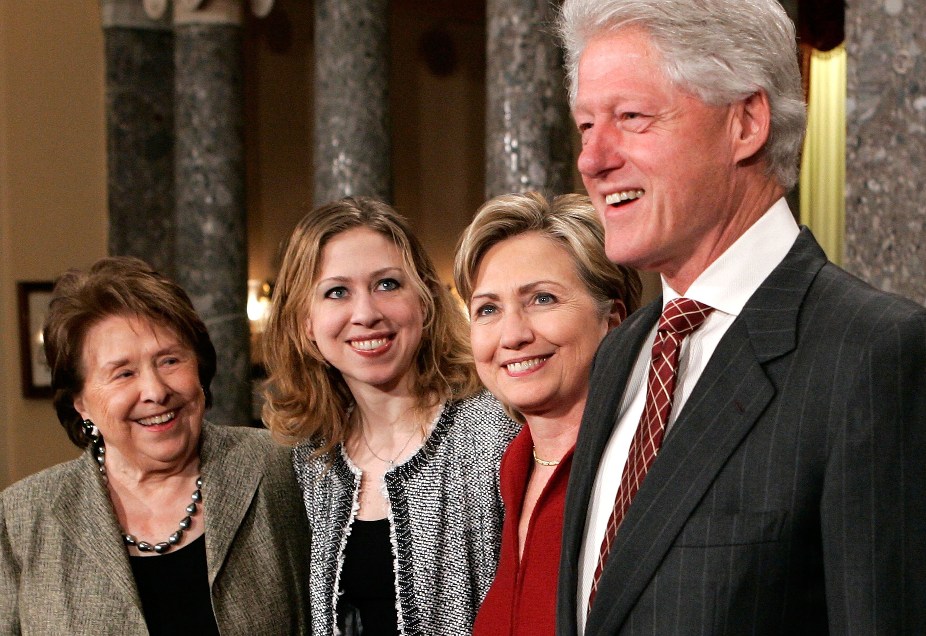 (R-L) Former U.S. President Bill Clinton, his wife Sen. Hillary Rodham Clinton (D-NY), their daughter Chelsea, and the senator's mother Dorothy Rodham pose for photographers during a mock swearing-in ceremony for the senator January 4, 2007 on Capitol Hill in Washington, DC. Members of the 110th Congress were sworn in today. (Photo by Alex Wong/Getty Images)
