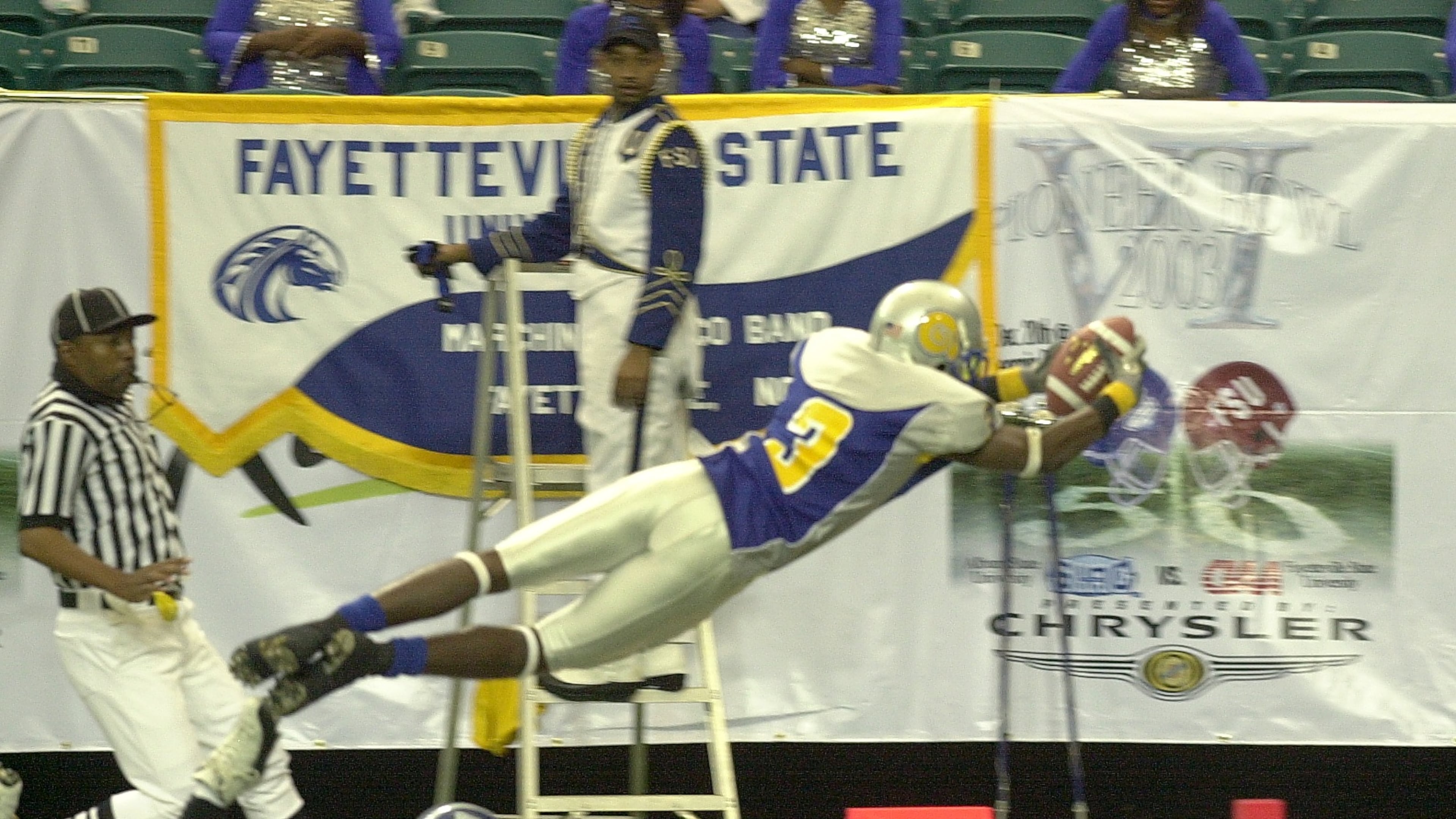 Albany State wide receiver Alvin Ray Jackson dives for a touchdown in the first quarter of the 2003 Pioneer Bowl against Fayetteville State. The Golden Rams won 52-30 to cap a 10-2 season. (W.A. Bridges Jr./AJC)